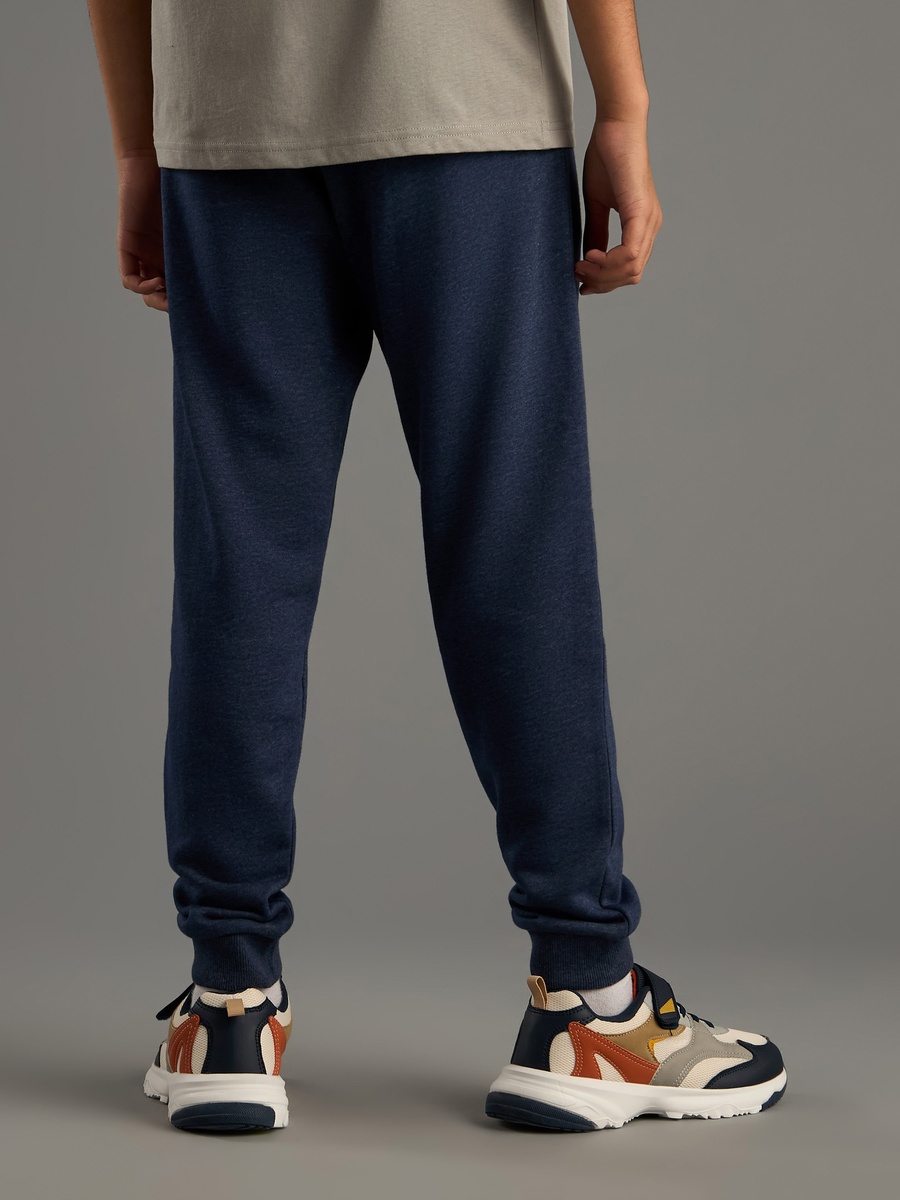 بنطال رياضي مضاد للوبر برباط وجيوب وطبعات