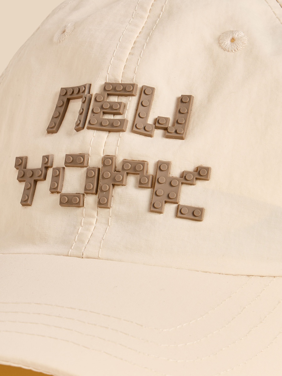 Applique Detail Cap with Buckled Strap Closure