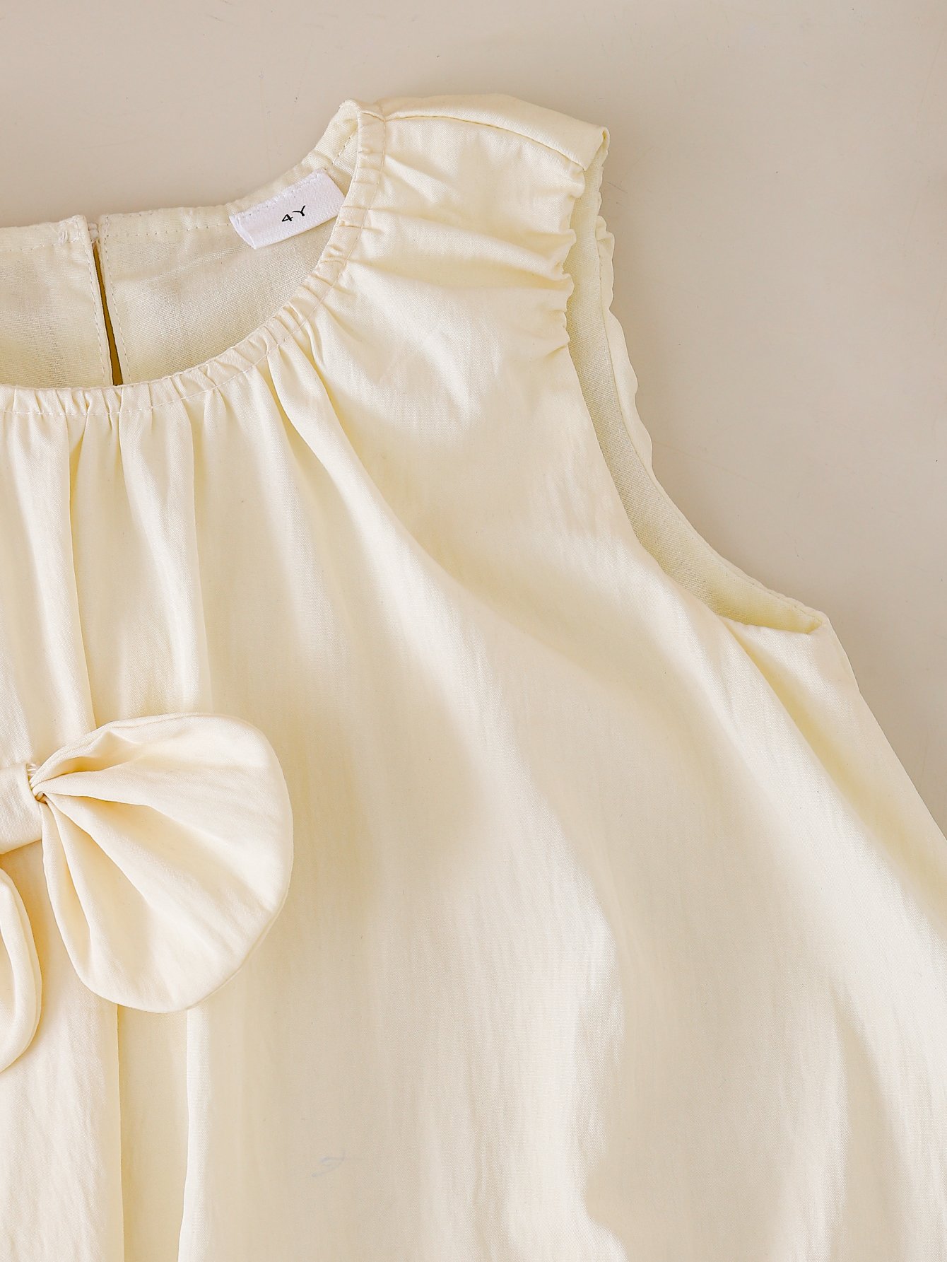 Girls Beige Sleeveless Dress with Bows