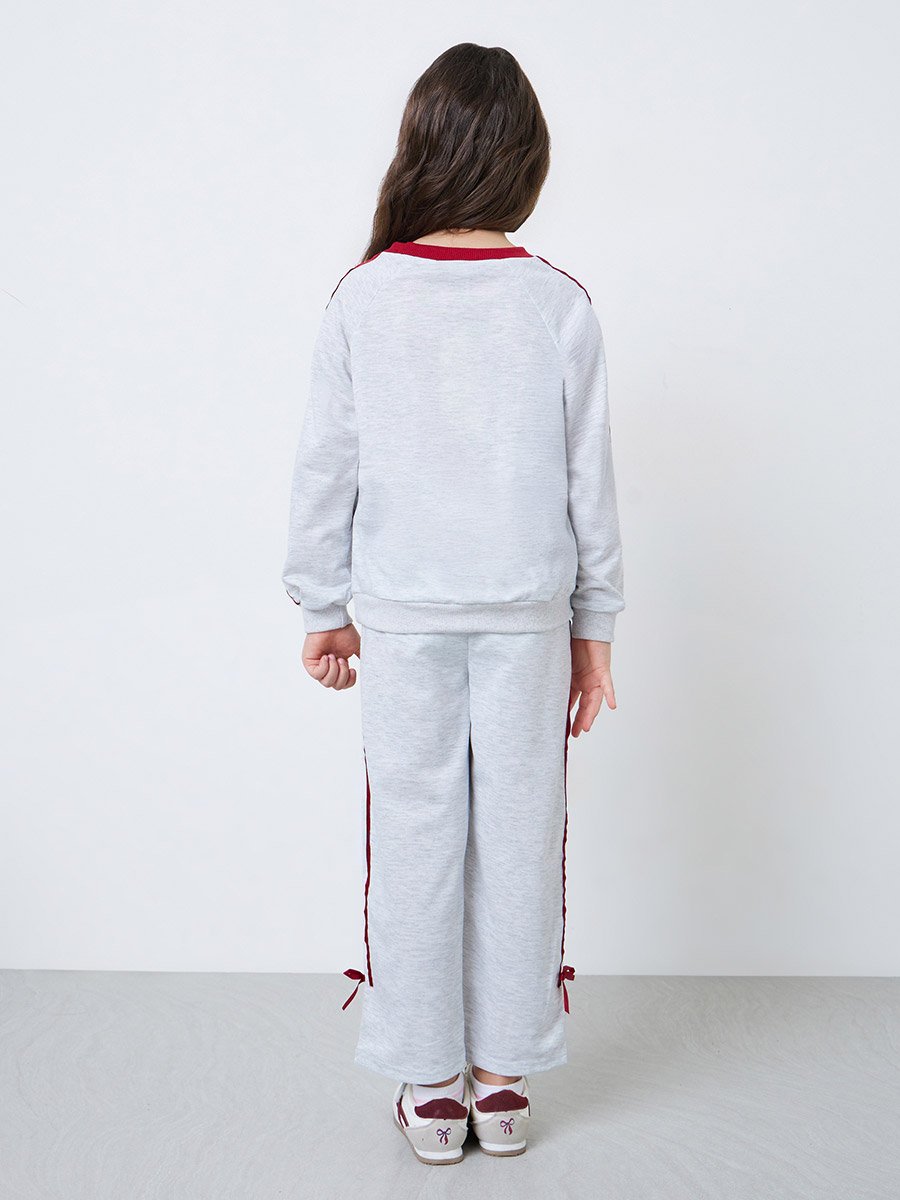 Toddler girl set with full sleeve graphic tee and wide leg jogger with side stripe and bow details