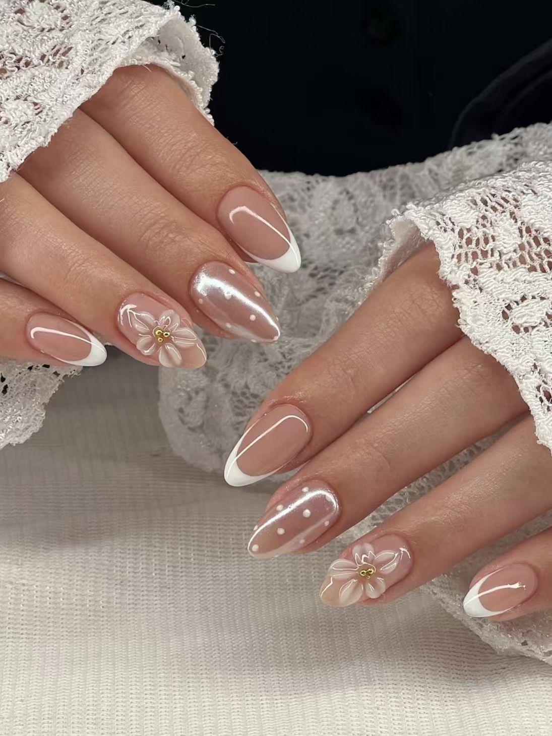 Almond French Tip Nails with 3D Floral and Pearl Accents