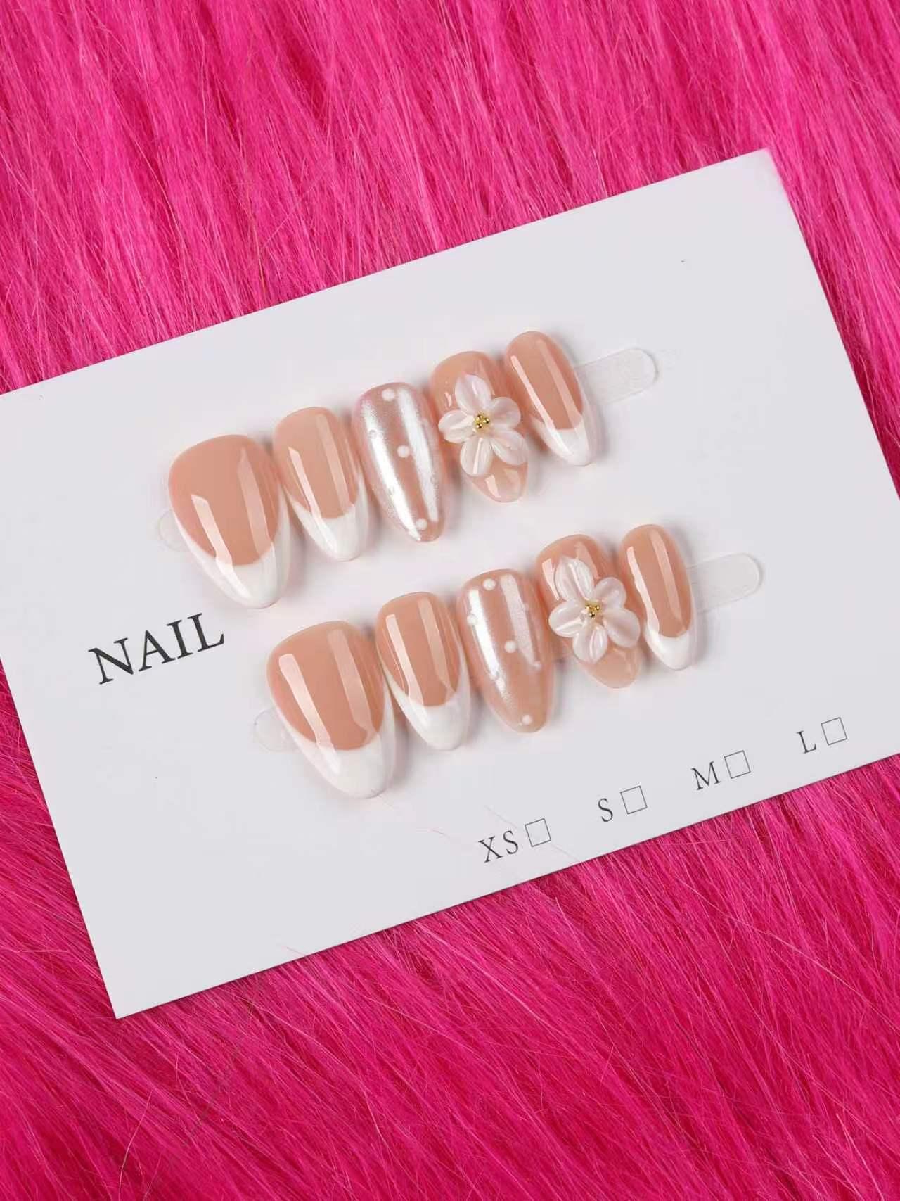 Almond French Tip Nails with 3D Floral and Pearl Accents