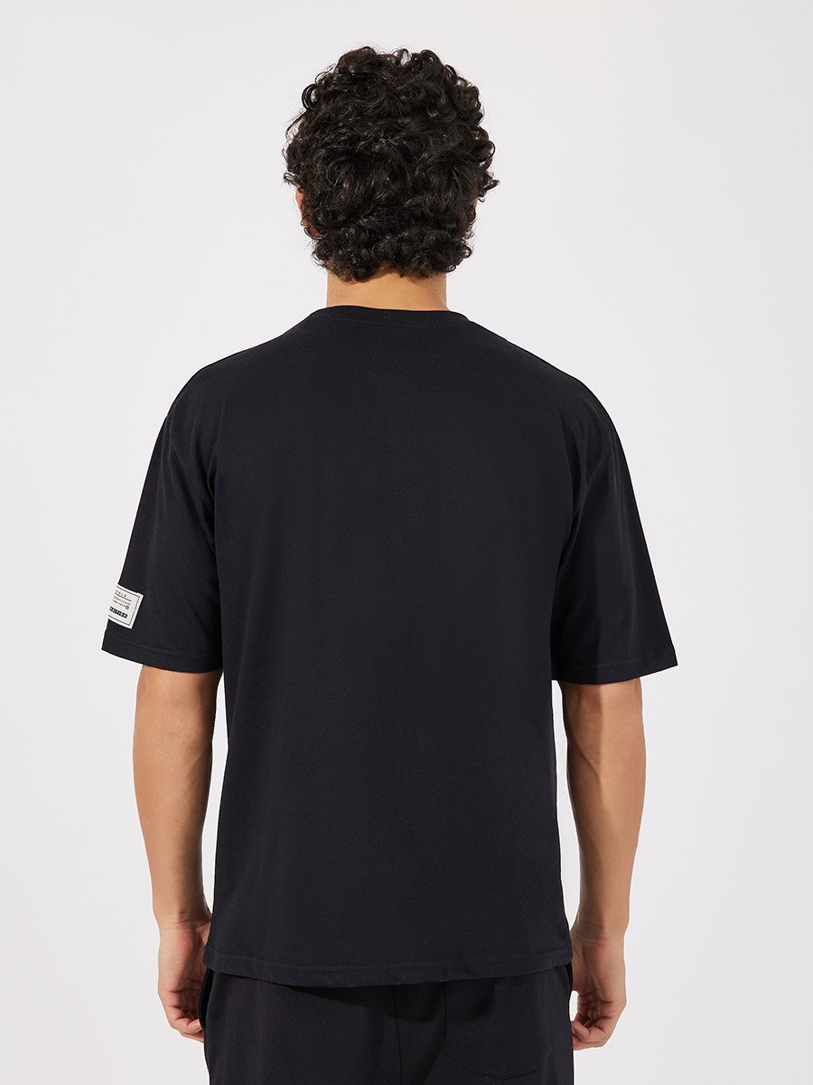 Reindeer Graphic Oversized T-Shirt with Sleeve Badge