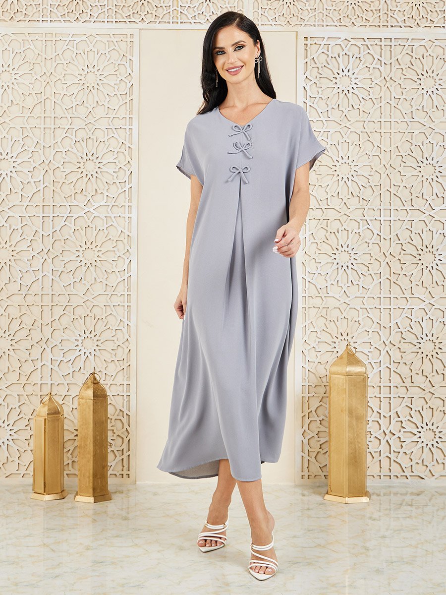short abaya dress This beautiful seasonal dress is designed for comfort and effortless style.  It features a round neckline with a short zipper down to the chest,  combining practicality with a clean, elegant look. The