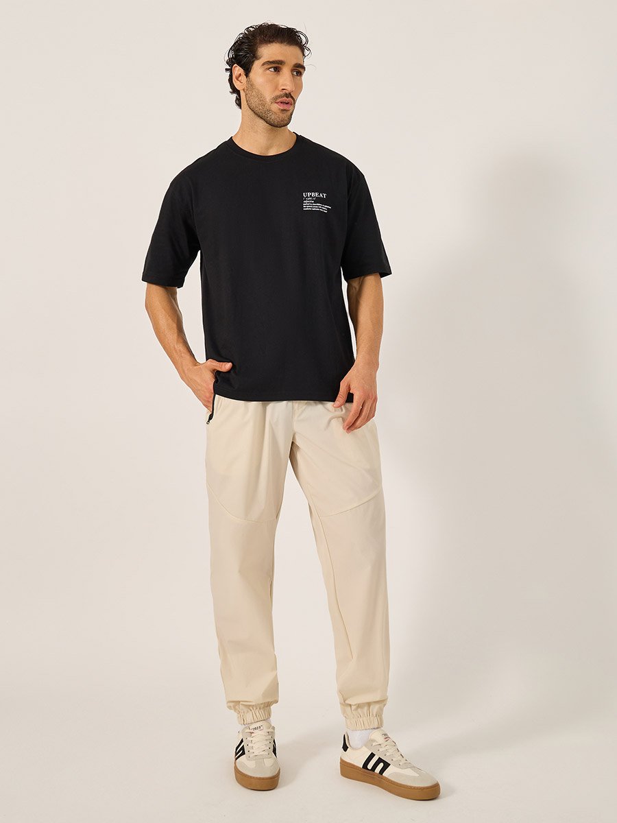 Solid Relaxed Fit Elasticated Cuff Joggers with Contrast Zip detail