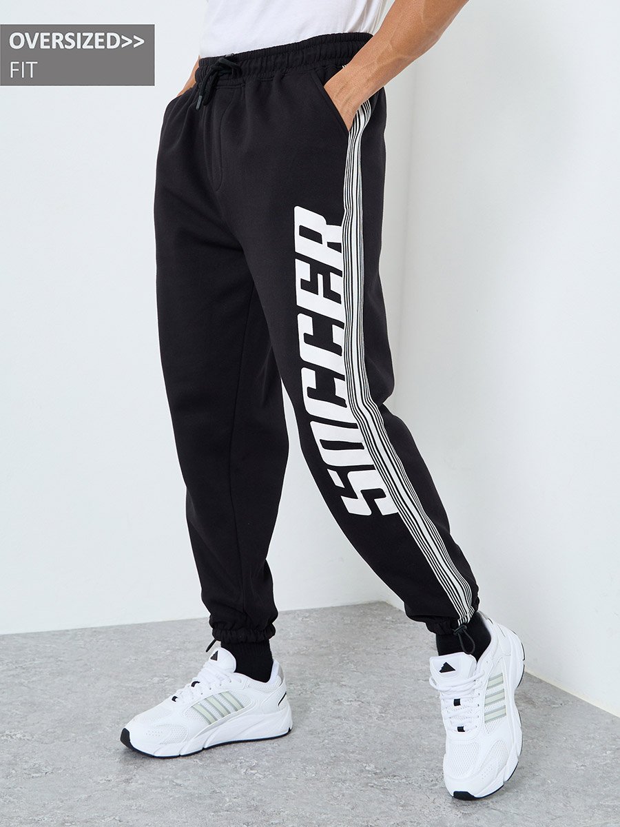 Men Black Graphic Oversized Joggers with Tape Detail