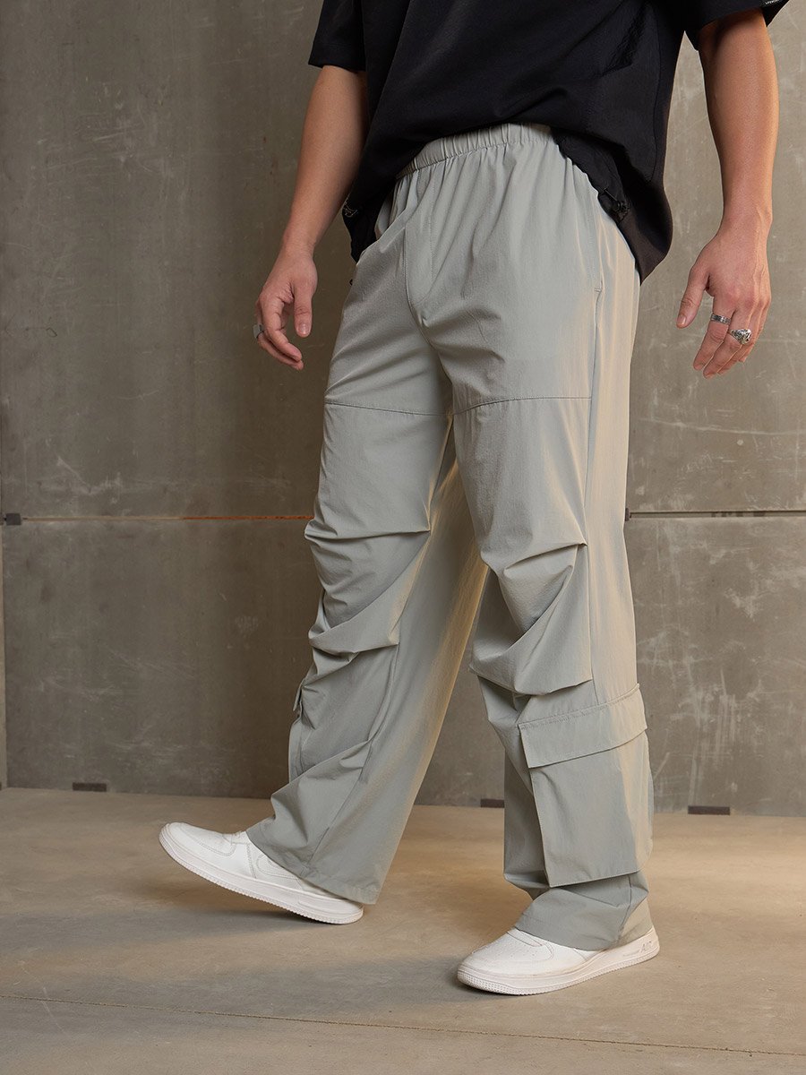 Pleated Knee Baggy Parachute Pants For Men at Saudi | Styli