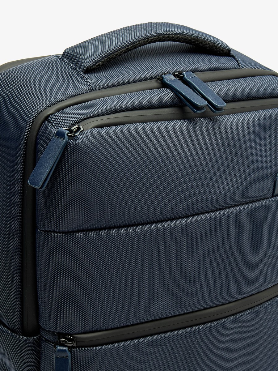 Solid Backpack with Adjustable Straps and Zip Closure