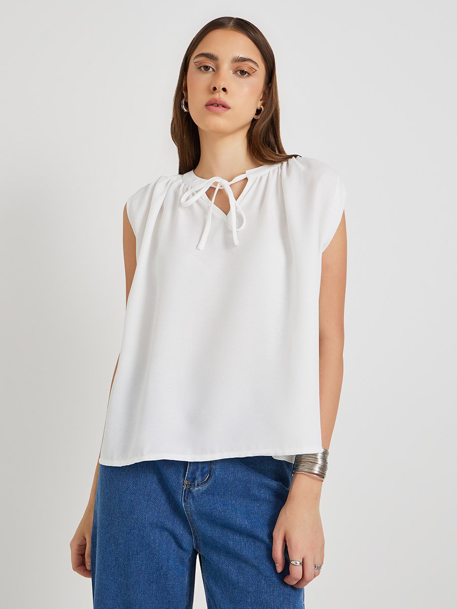 Solid Sleeveless Tie-Up Neck Blouse