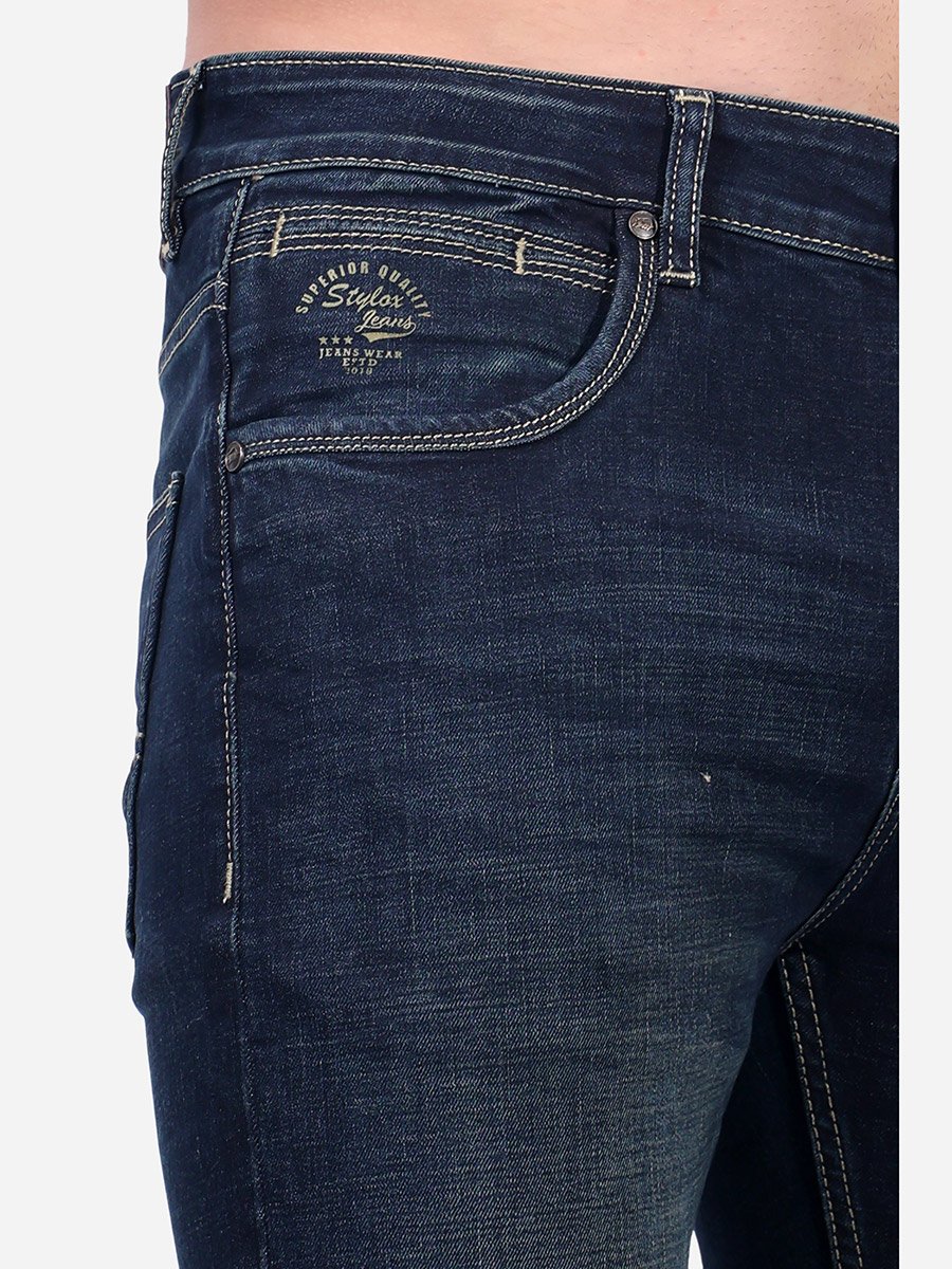 Mid Rise Whiskered Faded Slim Fit Jeans