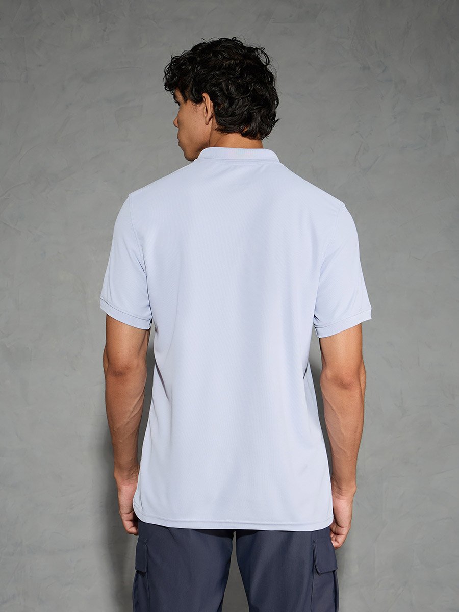 Men Light Blue Solid Slim Fit Polo
