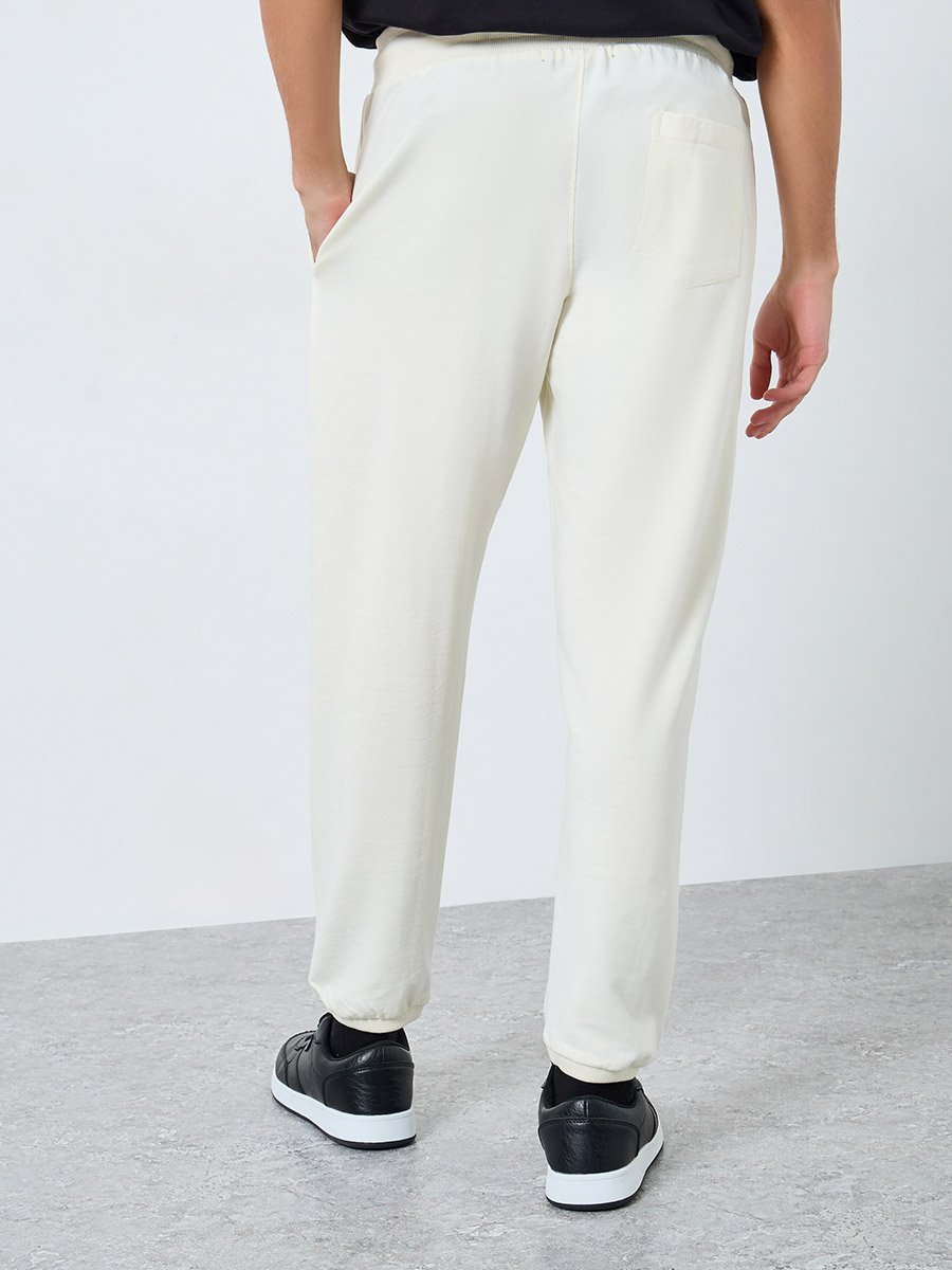 Men Cream Pocket Print Terry Joggers