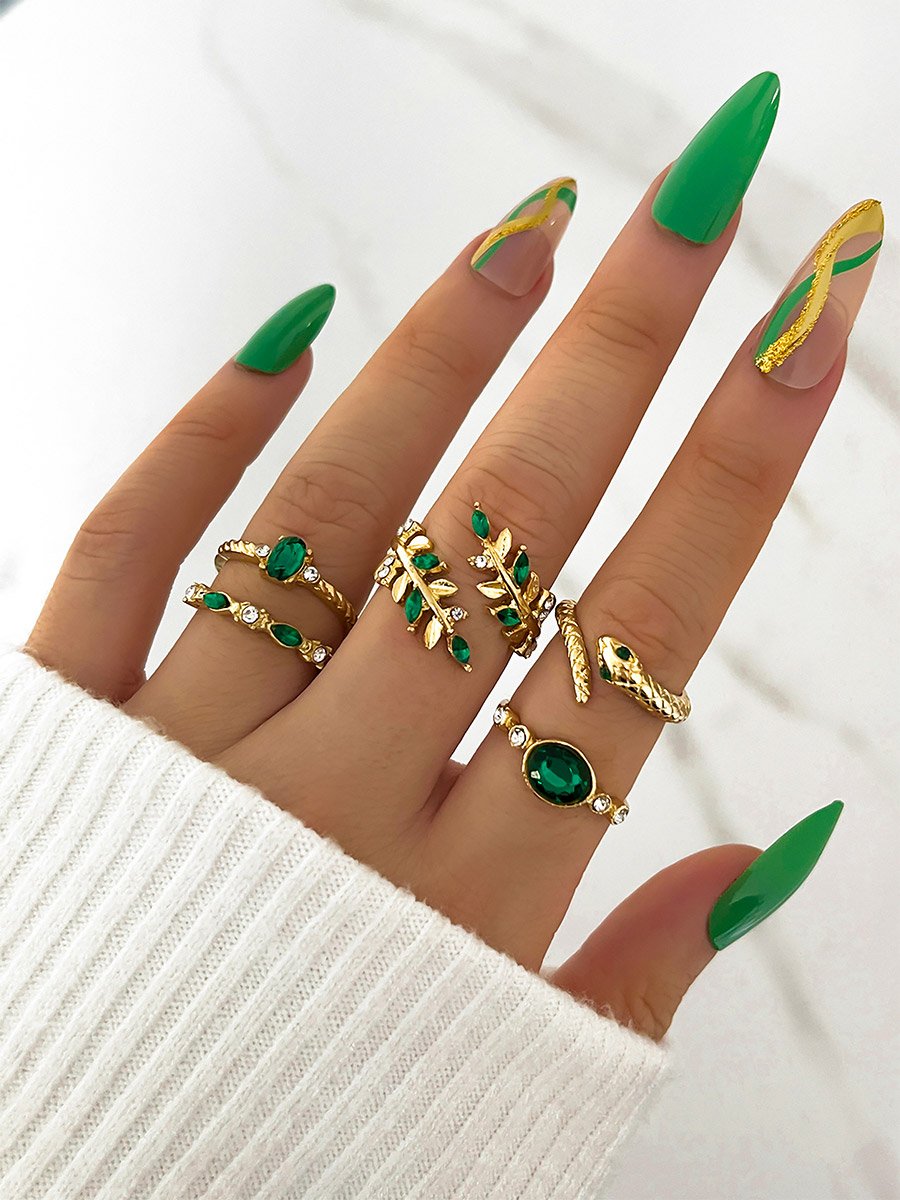 Set of 5 - Gold Tone Rings with Green Accent
