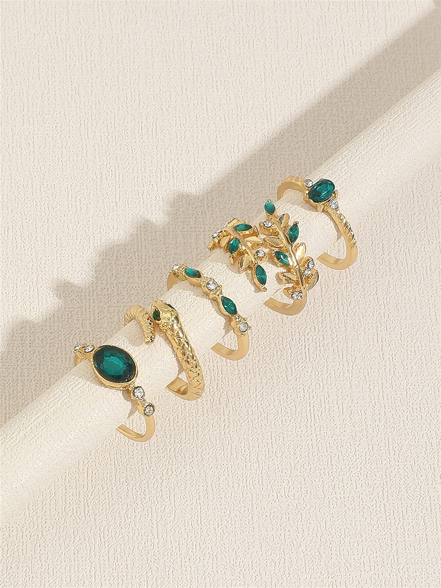Set of 5 - Gold Tone Rings with Green Accent