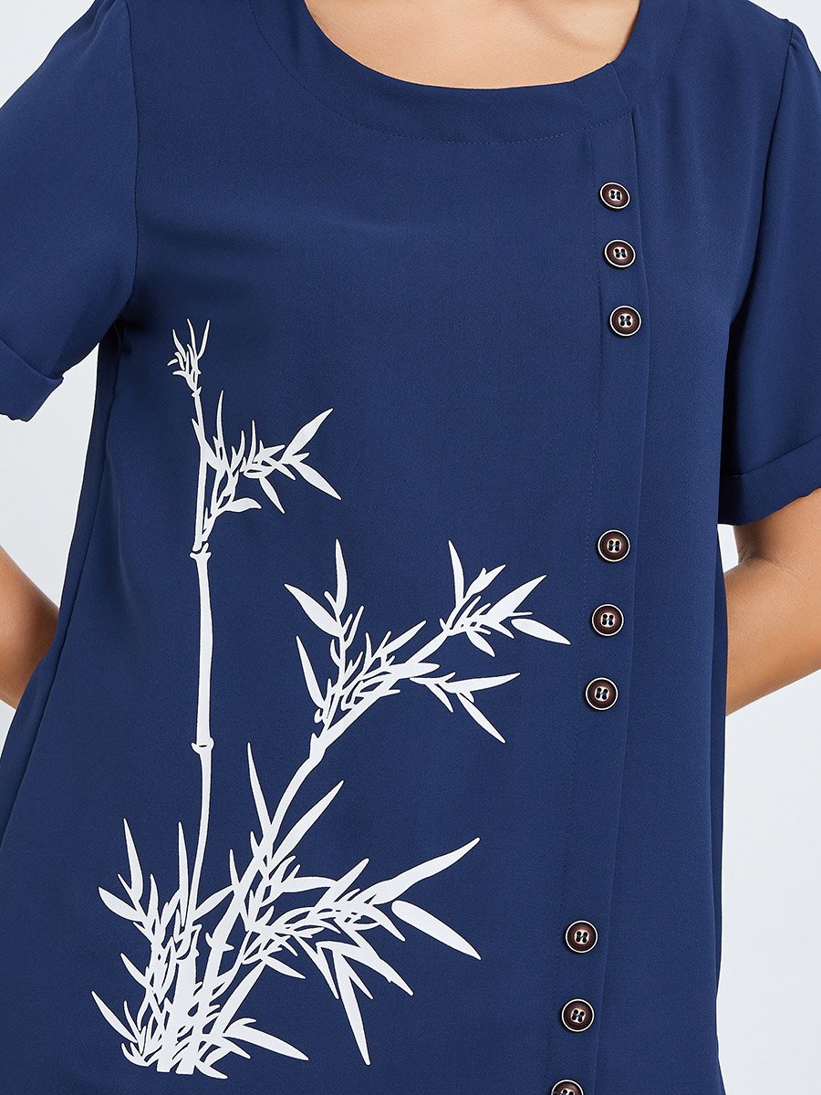 بلوزة بياقة دائرية وأكمام قصيرة مع طبعة جرافيك وأزرار