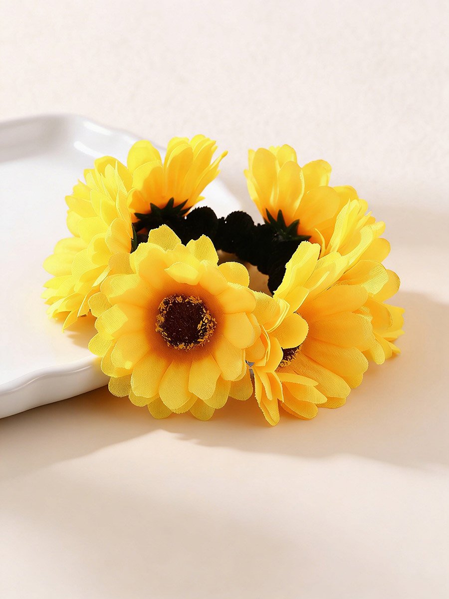ربطة شعر بزهرة صفراء