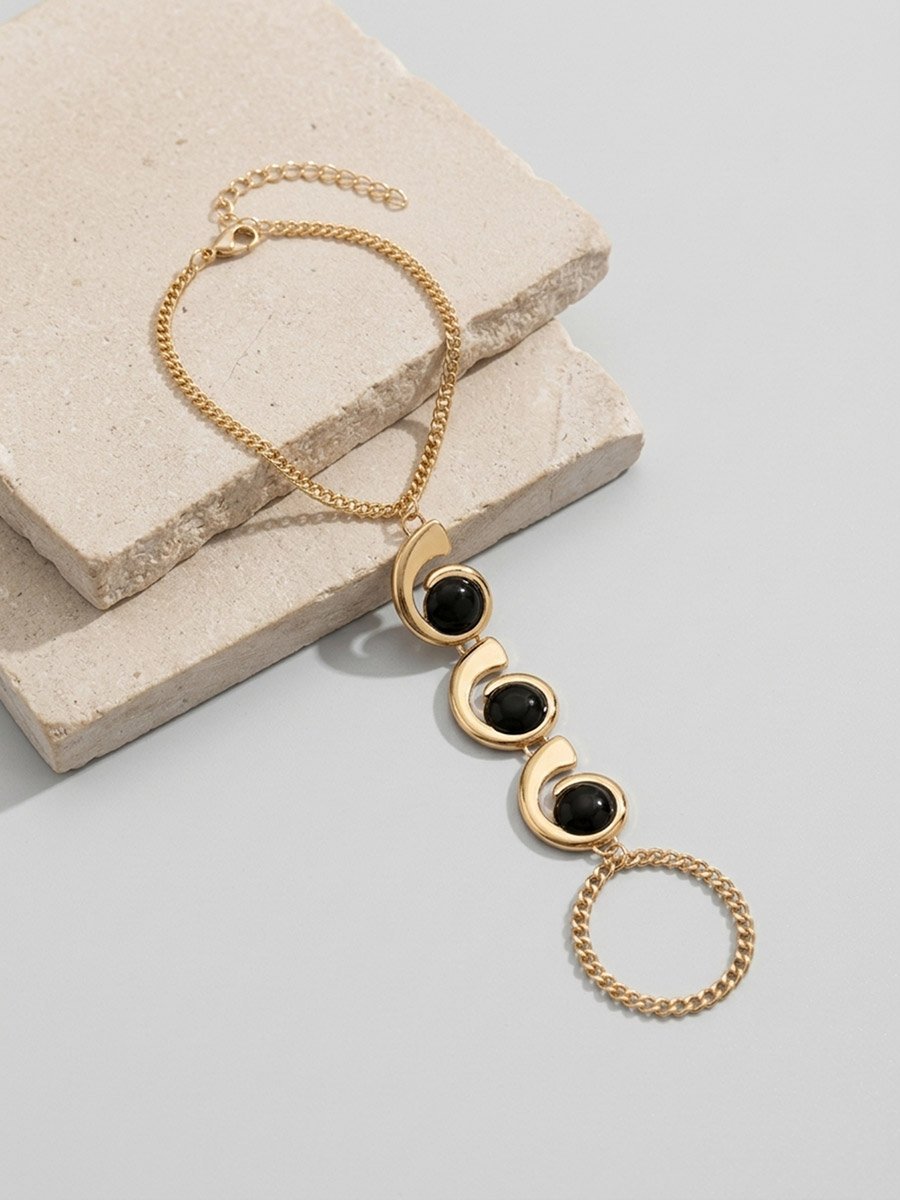 Gold Hand Chain Bracelet with Black Accents
