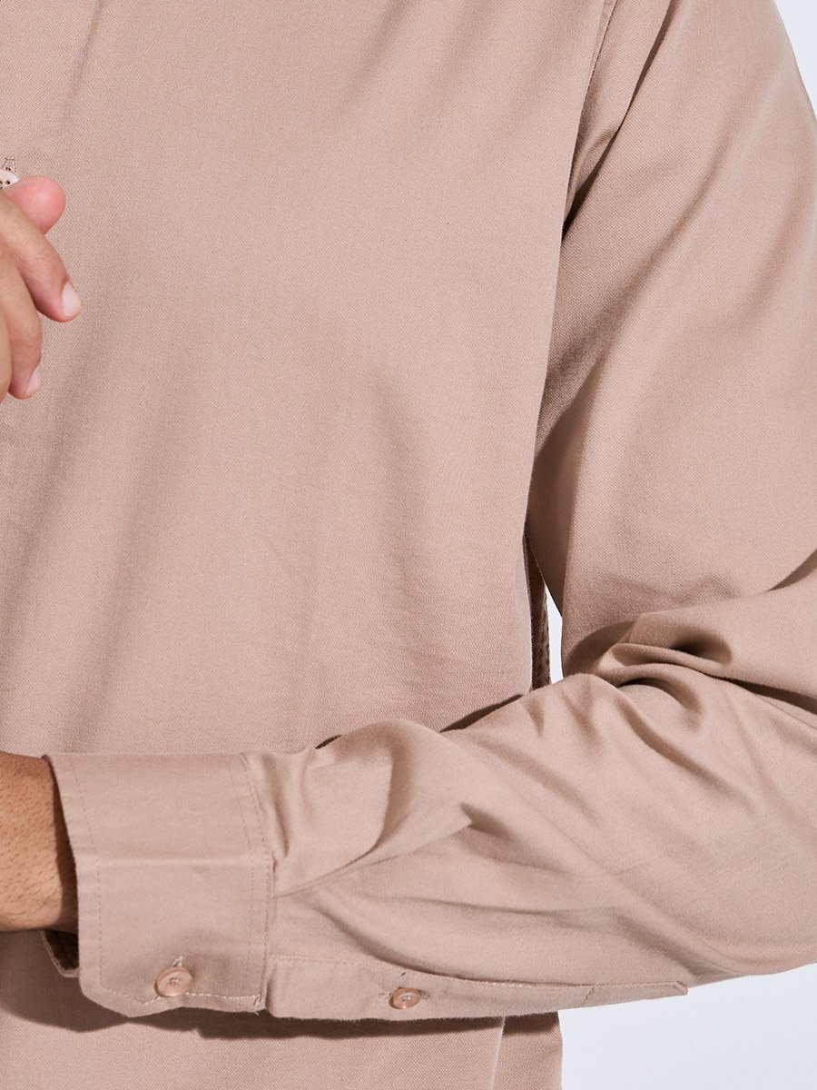 قميص بأكمام طويلة بلون سادة