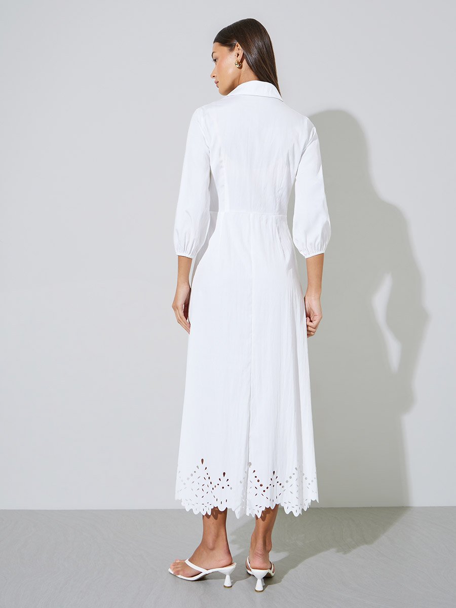 فستان طويل بحافة واسعة وأكمام 3/4 وتفاصيل شيفلي
