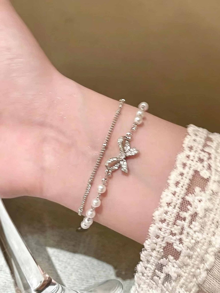 سوار متعدد الطبقات بتفاصيل فيونكة ولؤلؤ صناعي