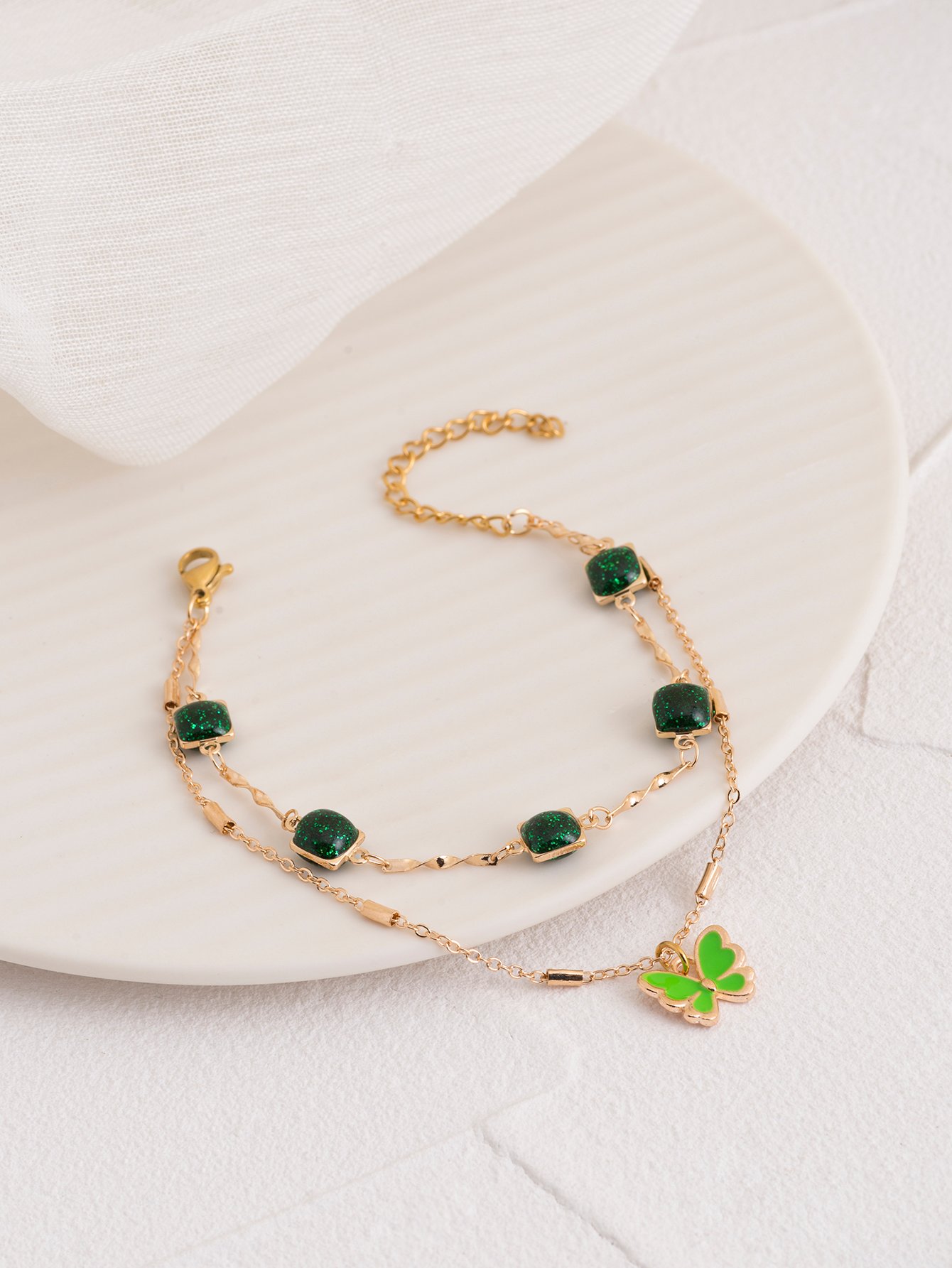 Gold Tone Green Gem and Butterfly Multistrand Bracelet
