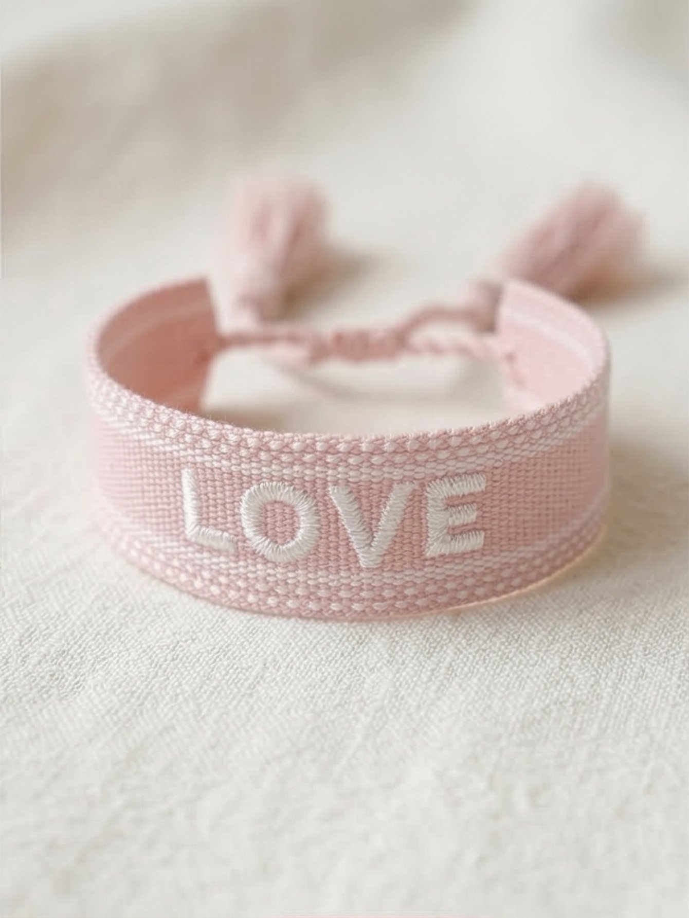 Pink Embroidered Woven Bracelet with Tassel Charm