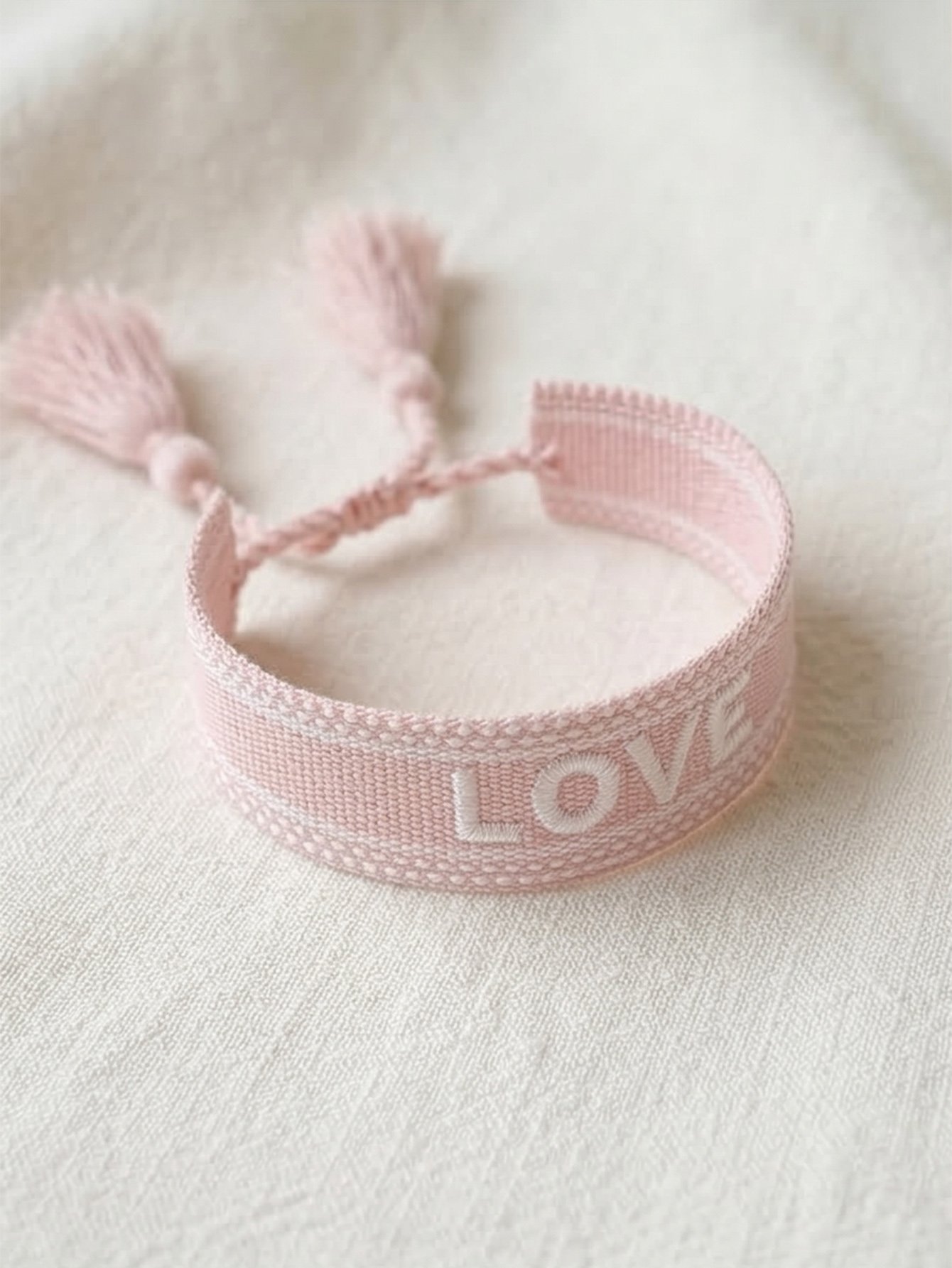 Pink Embroidered Woven Bracelet with Tassel Charm