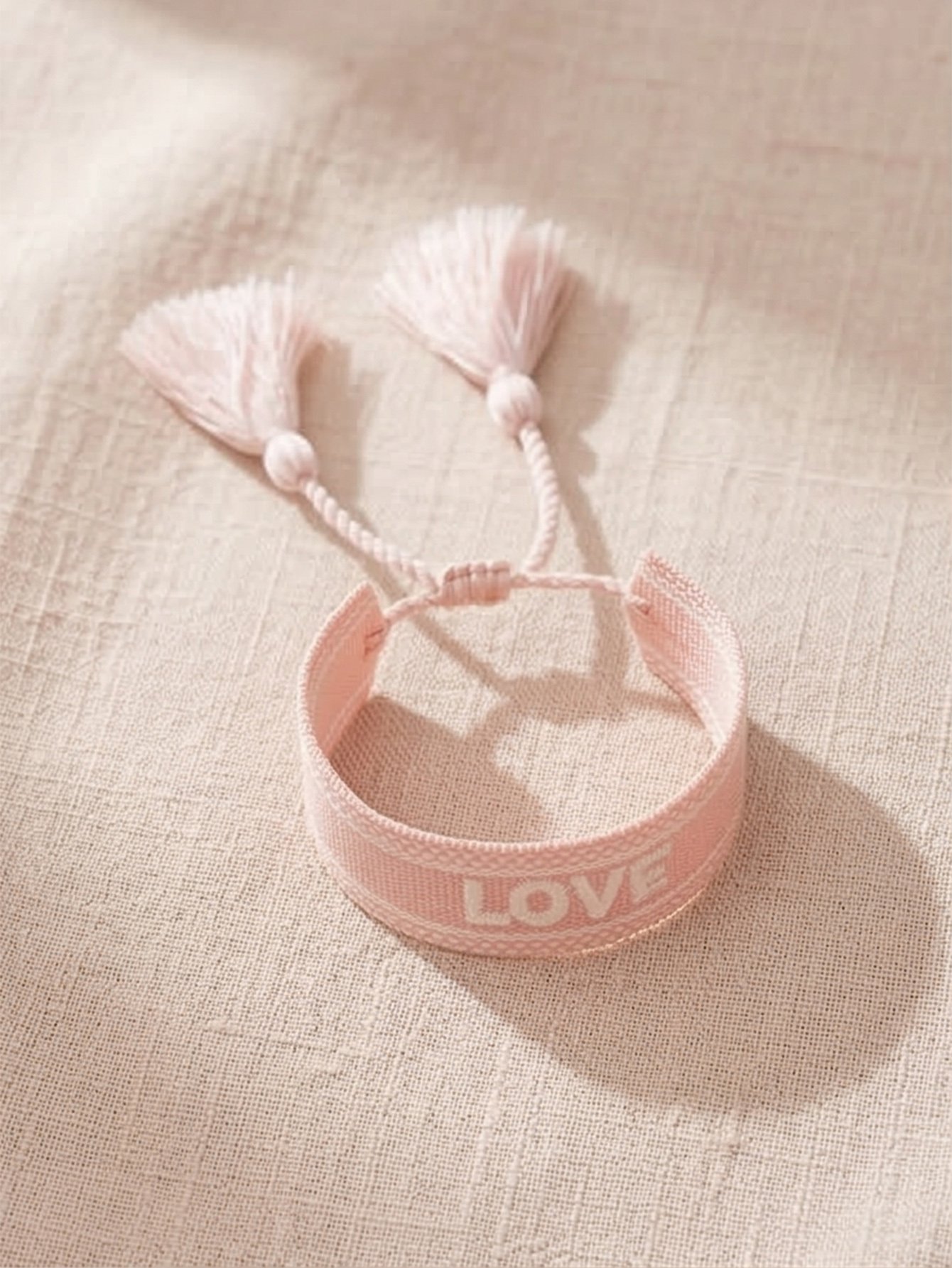 Pink Embroidered Woven Bracelet with Tassel Charm