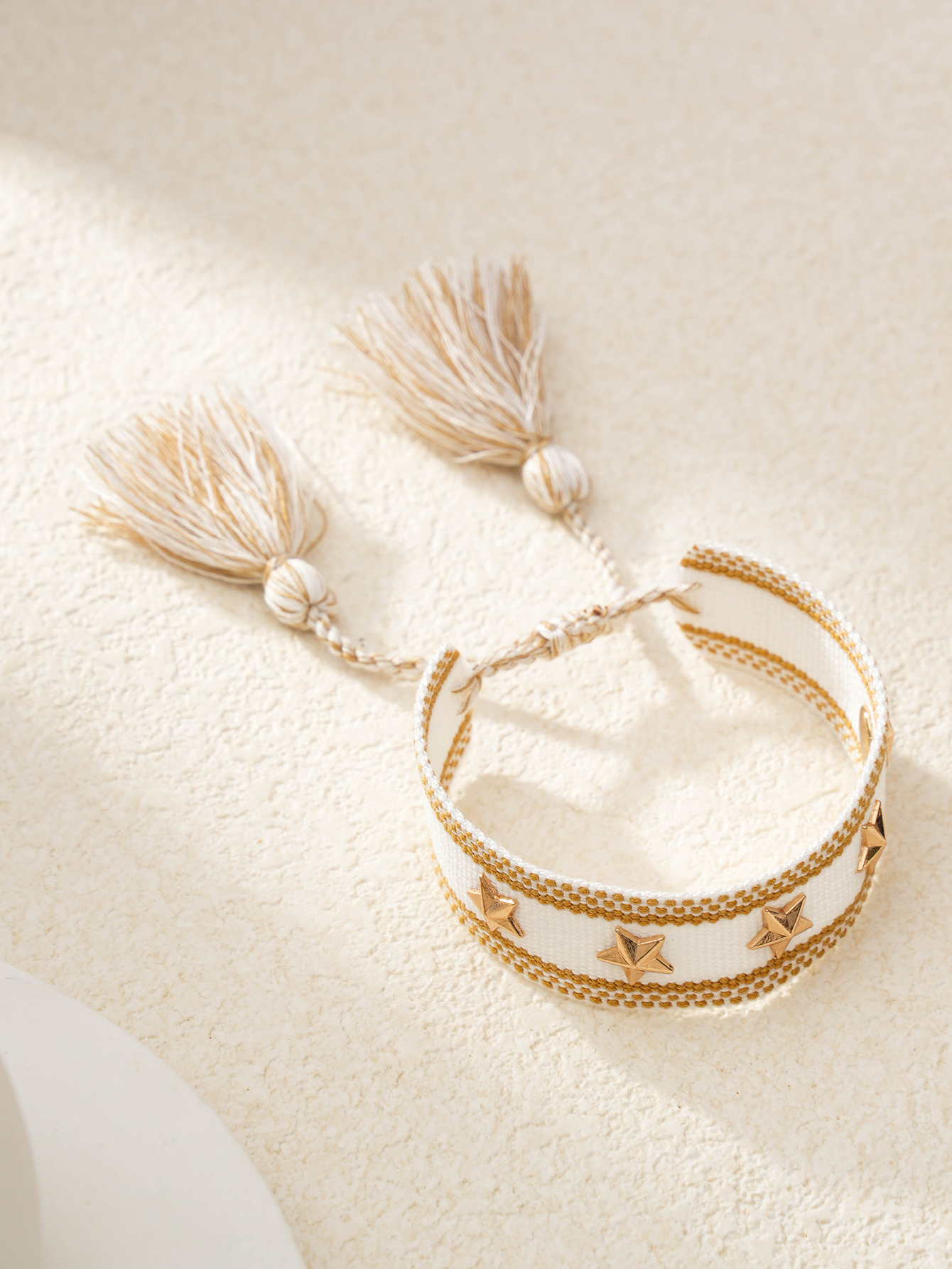 Multi-Color Star Embellished Woven Bracelet with Tassel Charm