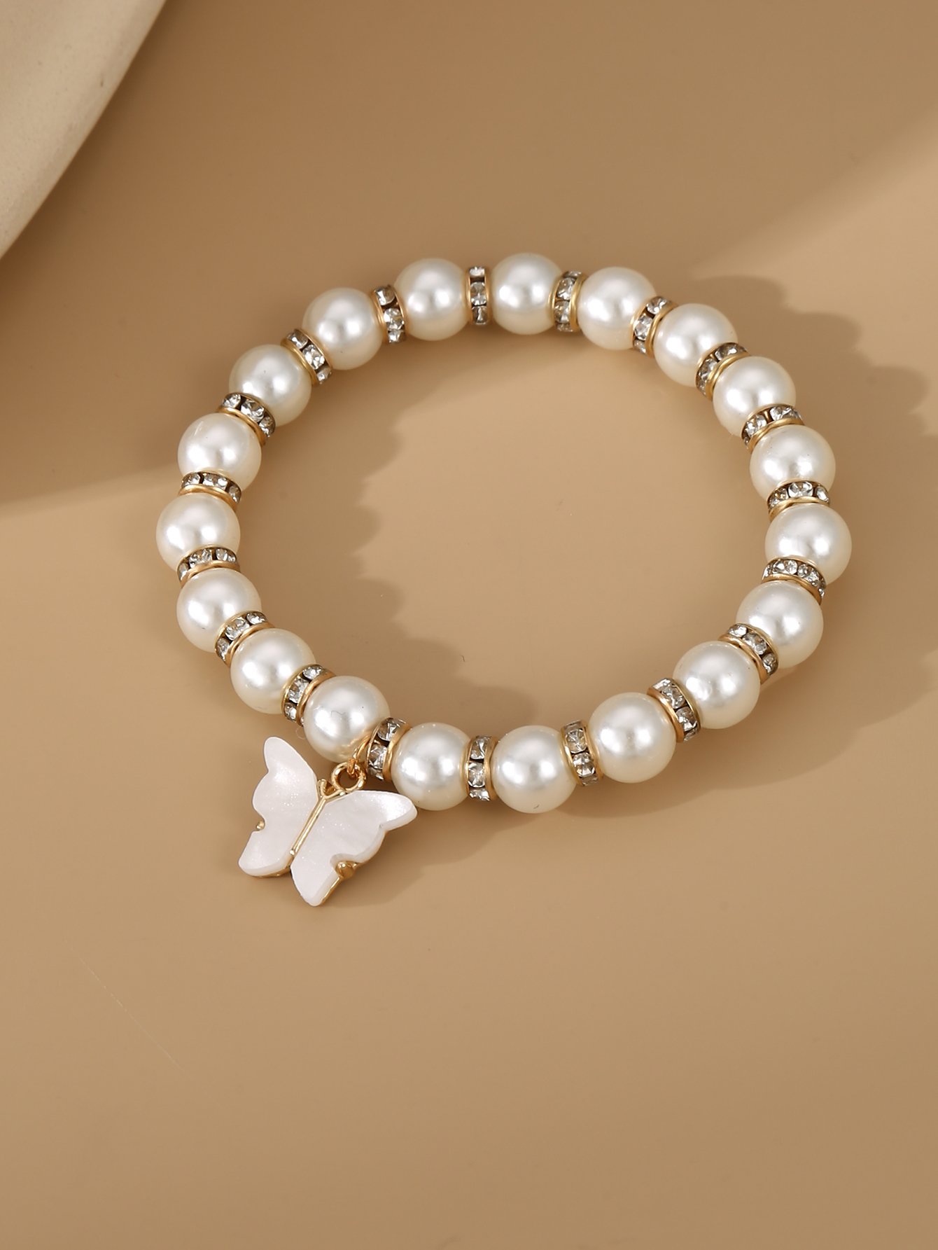 White Pearls and Rhinestone Embellished with Butterfly Charm Bracelet