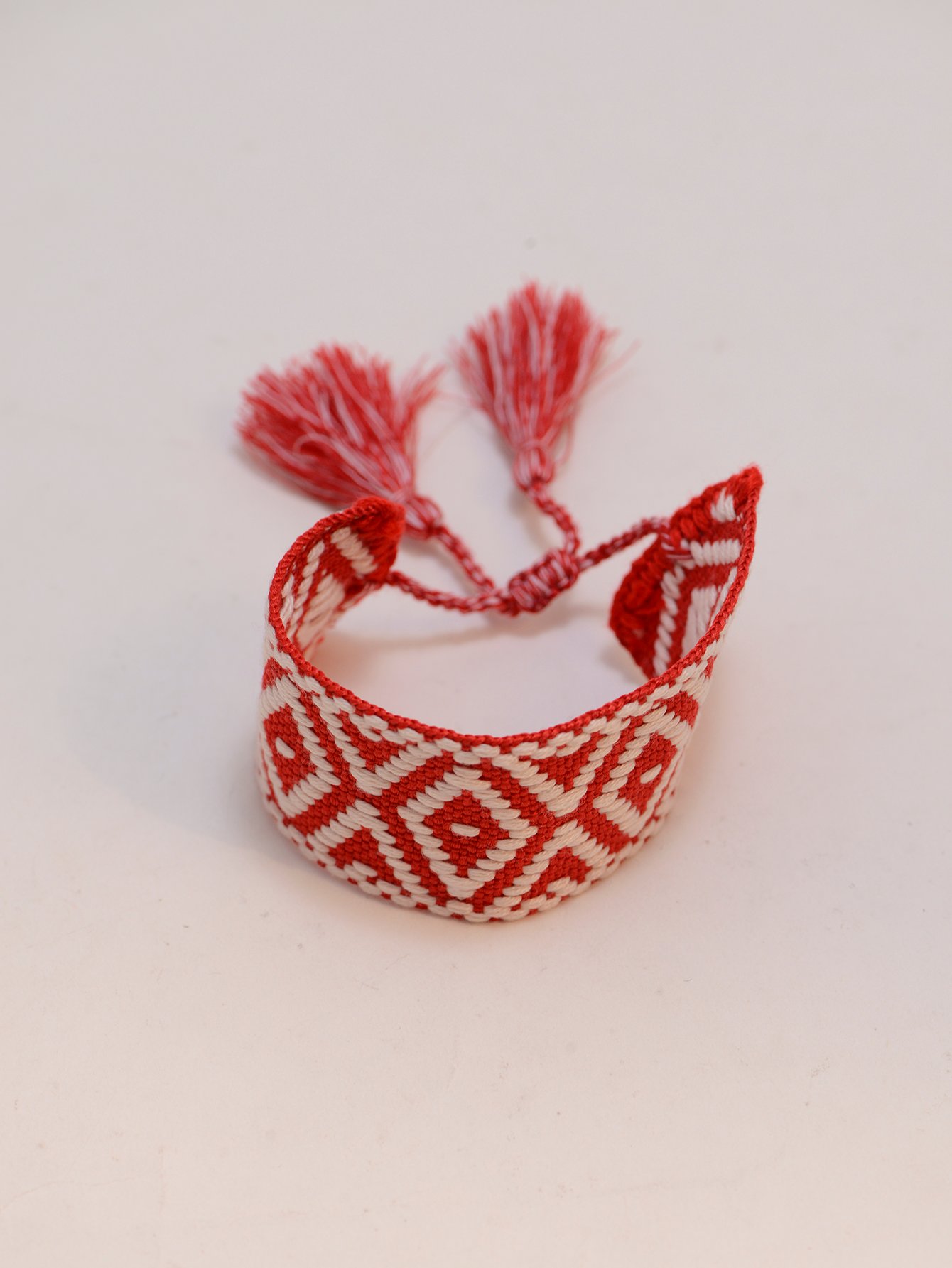 Geometric Pattern Woven Tassel Bracelet