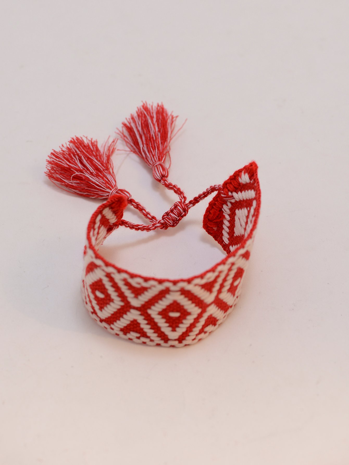 Geometric Pattern Woven Tassel Bracelet