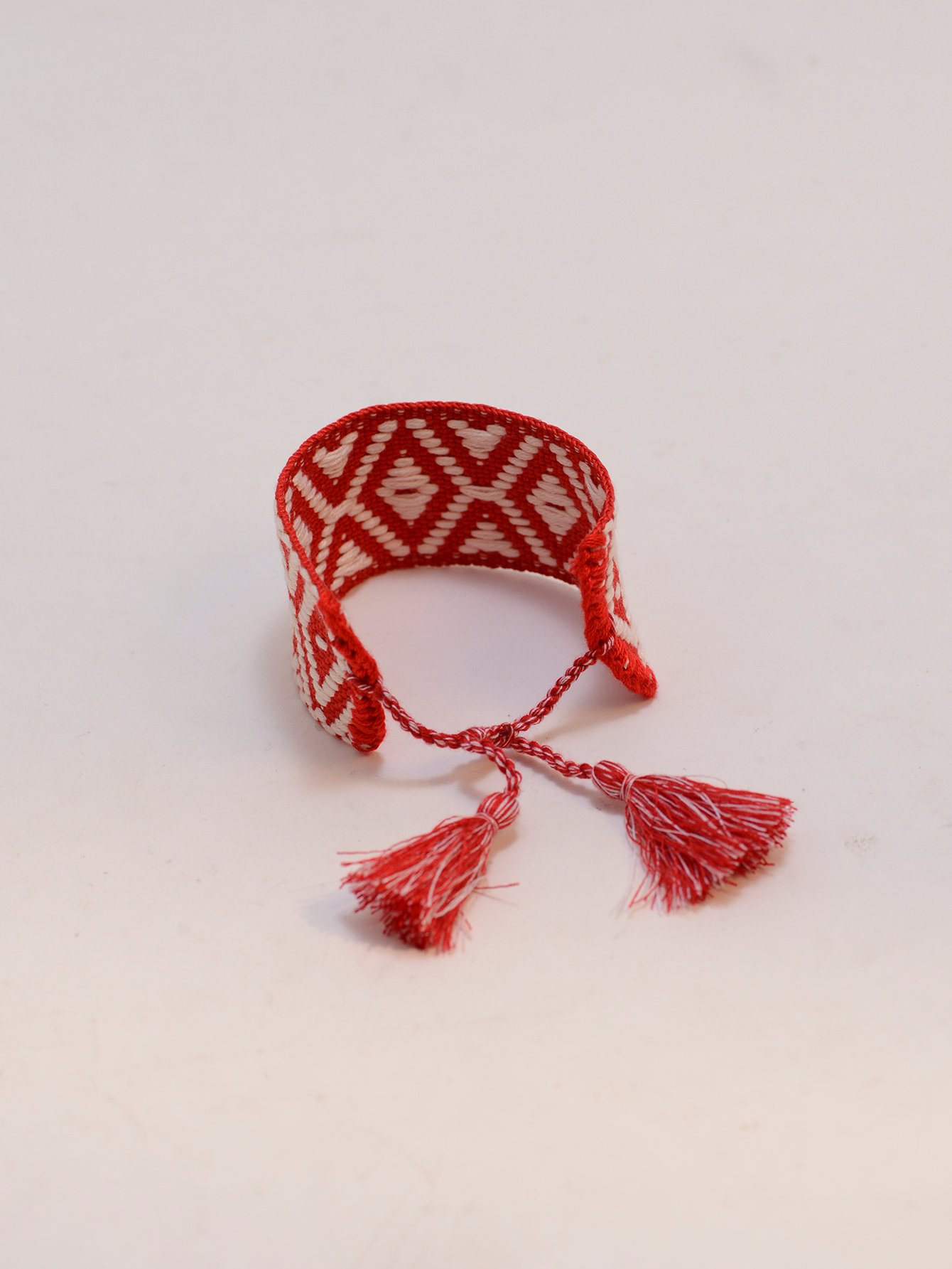 Geometric Pattern Woven Tassel Bracelet