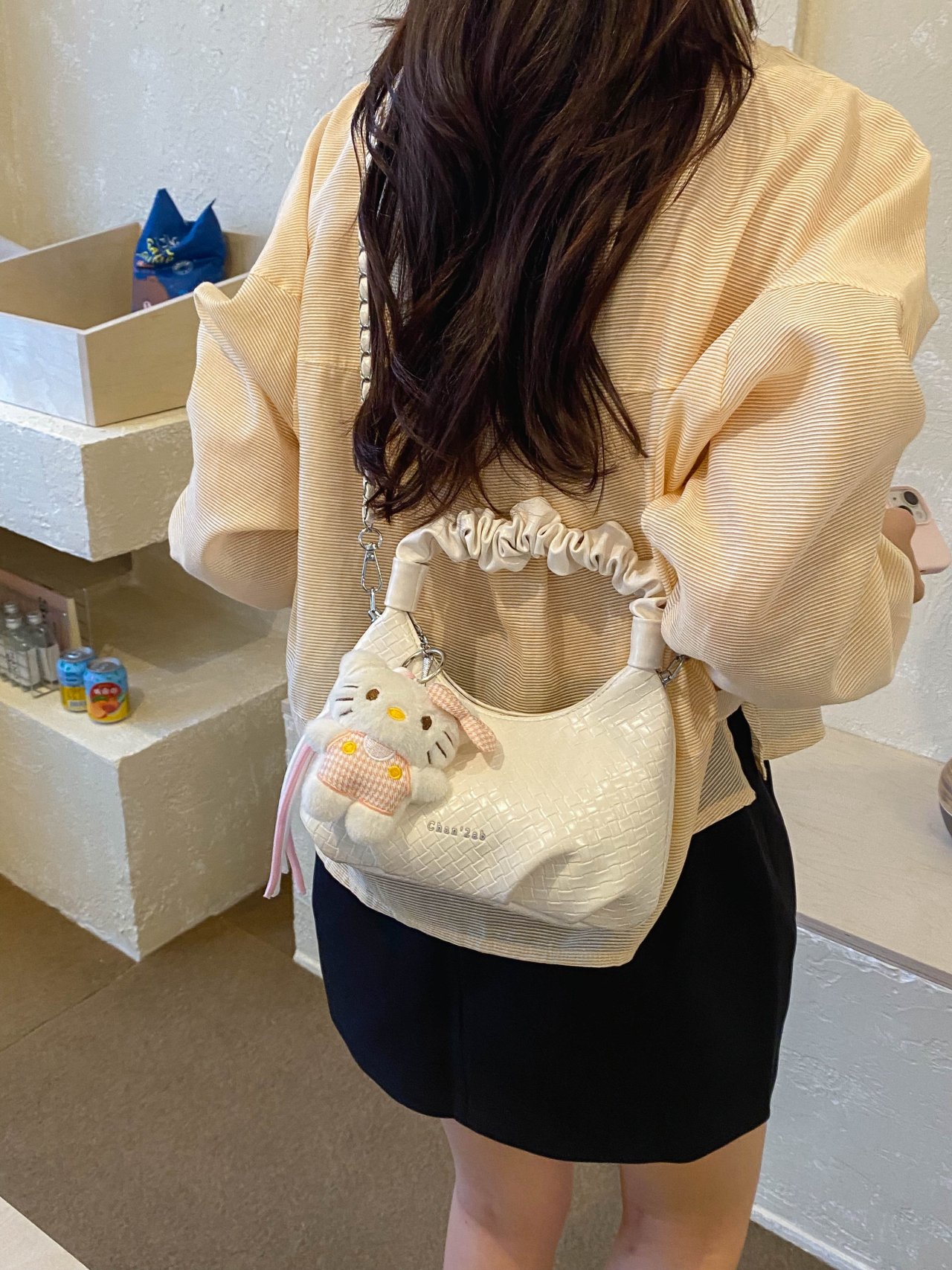 Textured Handbag with Plush Charm