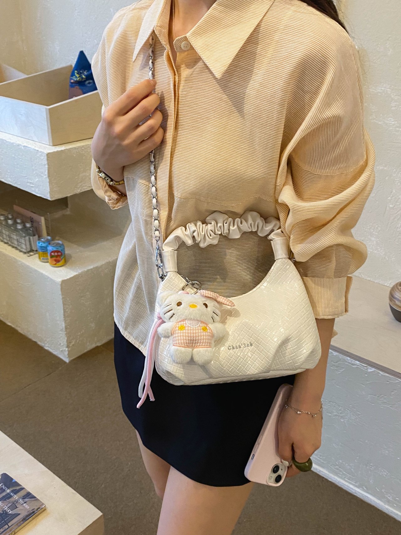 Textured Handbag with Plush Charm