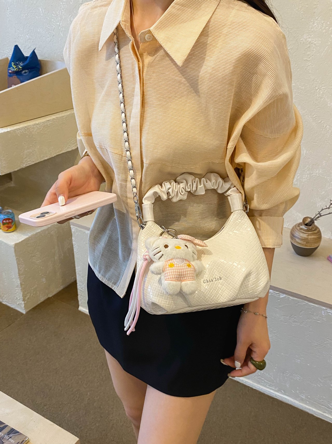 Textured Handbag with Plush Charm