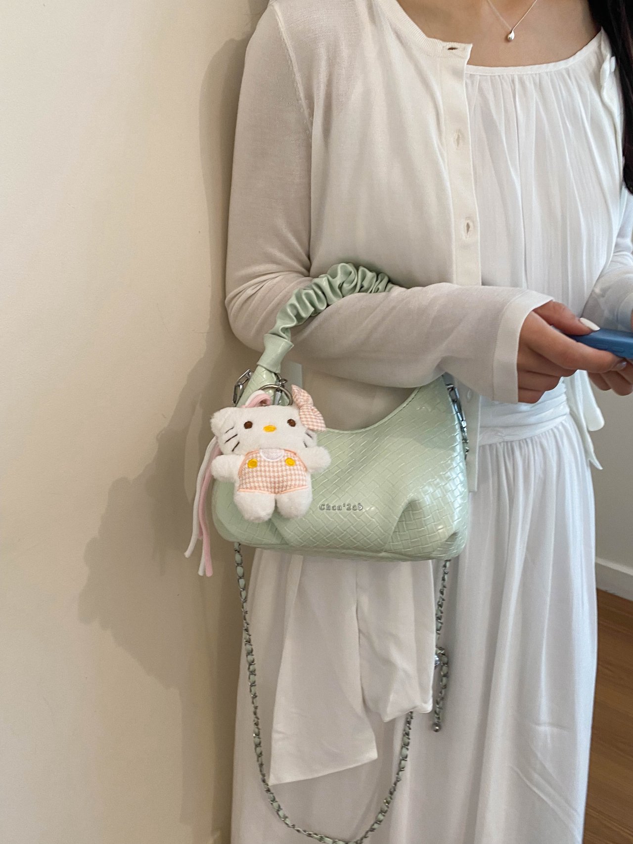 Textured Handbag with Plush Charm