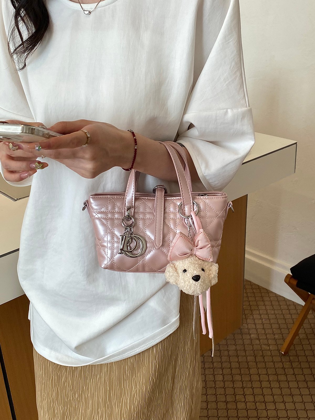 Quilted Handbag with Plush Charm
