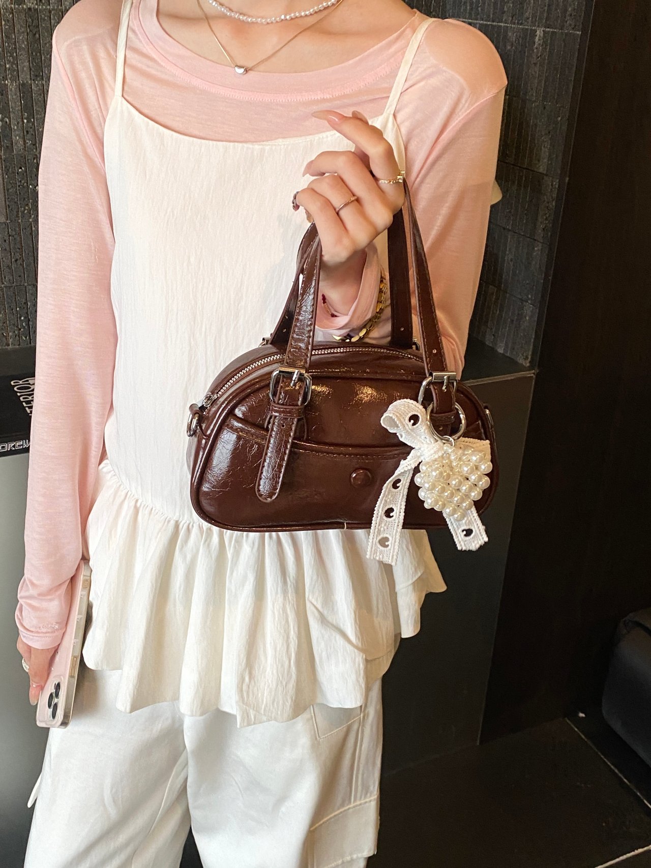 Solid Handbag with Buckle Strap and Charm