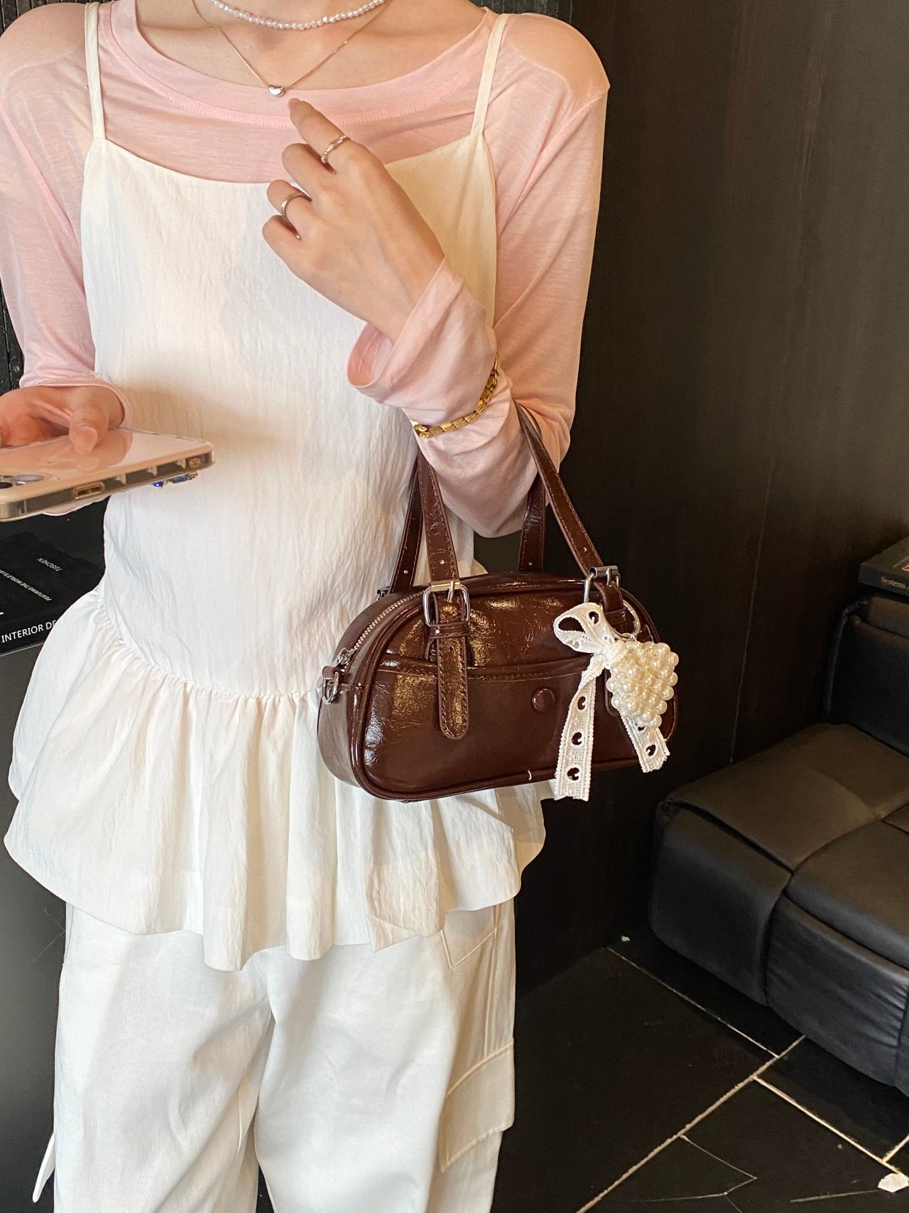 Solid Handbag with Buckle Strap and Charm