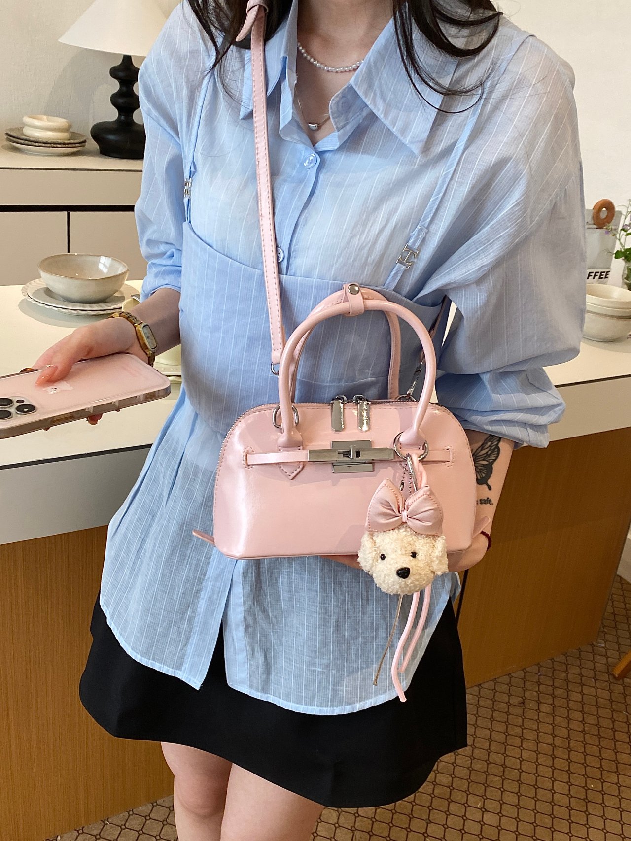 Solid Handbag with Plush Charm and Turn-Lock Detail