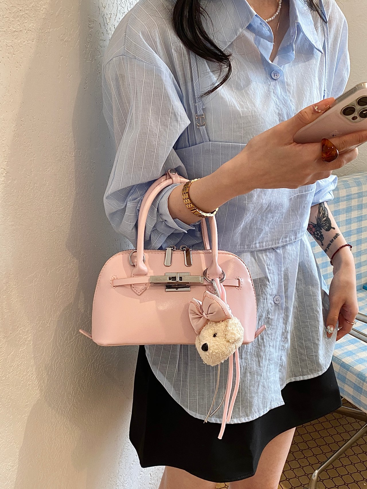 Solid Handbag with Plush Charm and Turn-Lock Detail