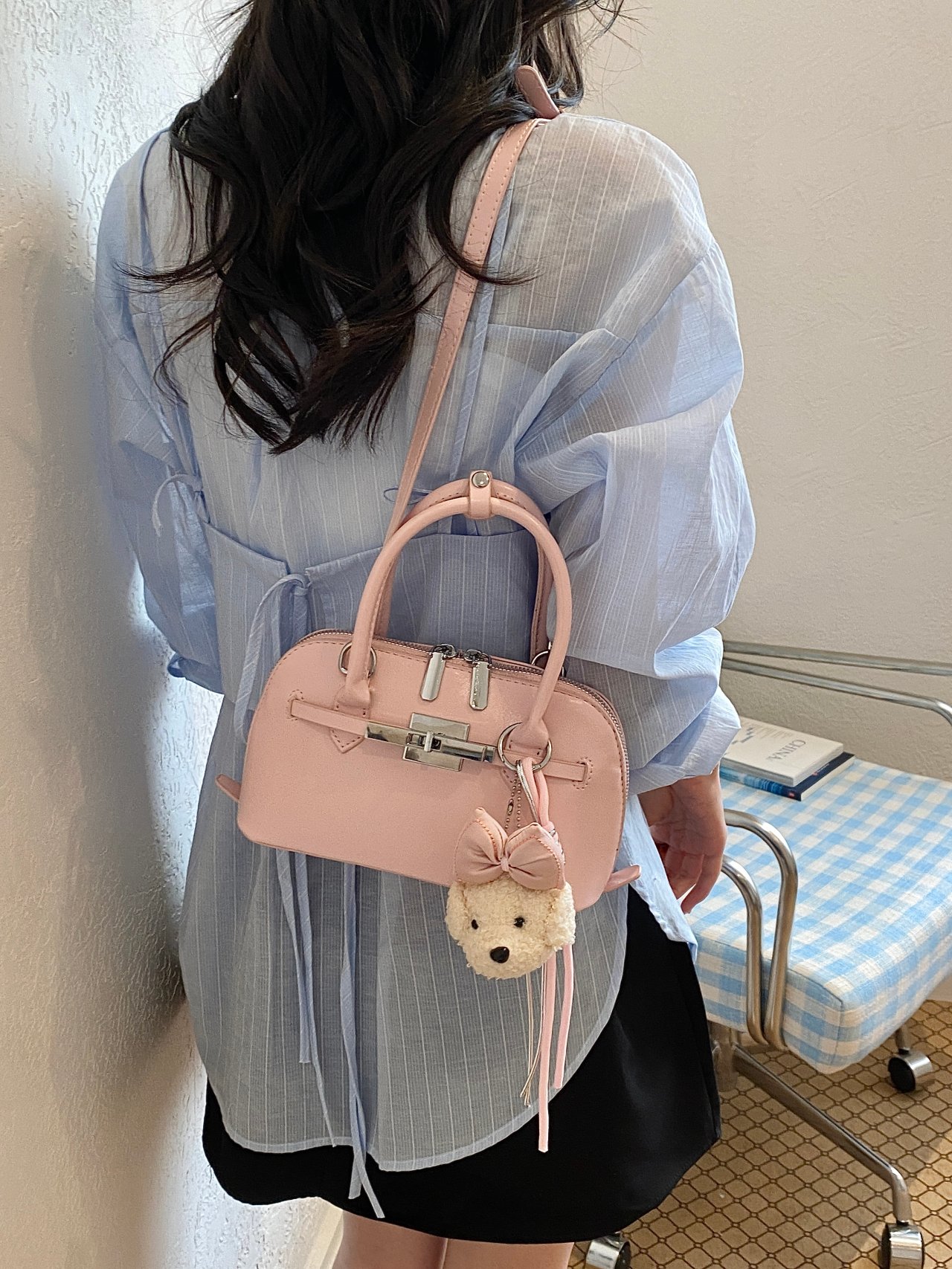 Solid Handbag with Plush Charm and Turn-Lock Detail