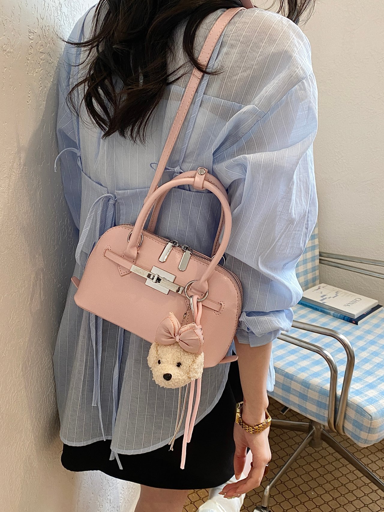 Solid Handbag with Plush Charm and Turn-Lock Detail