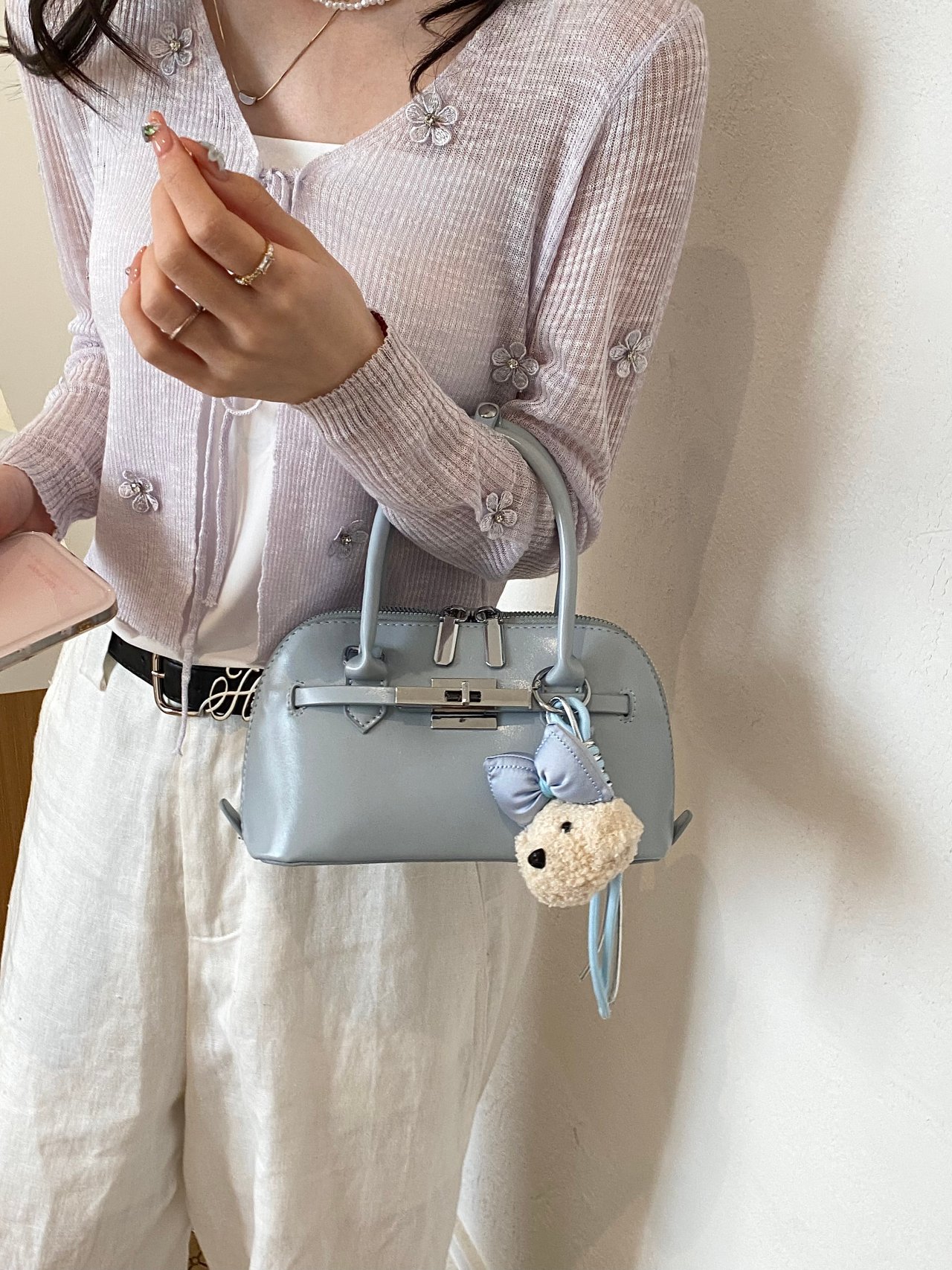 Solid Handbag with Plush Charm and Turn-Lock Detail