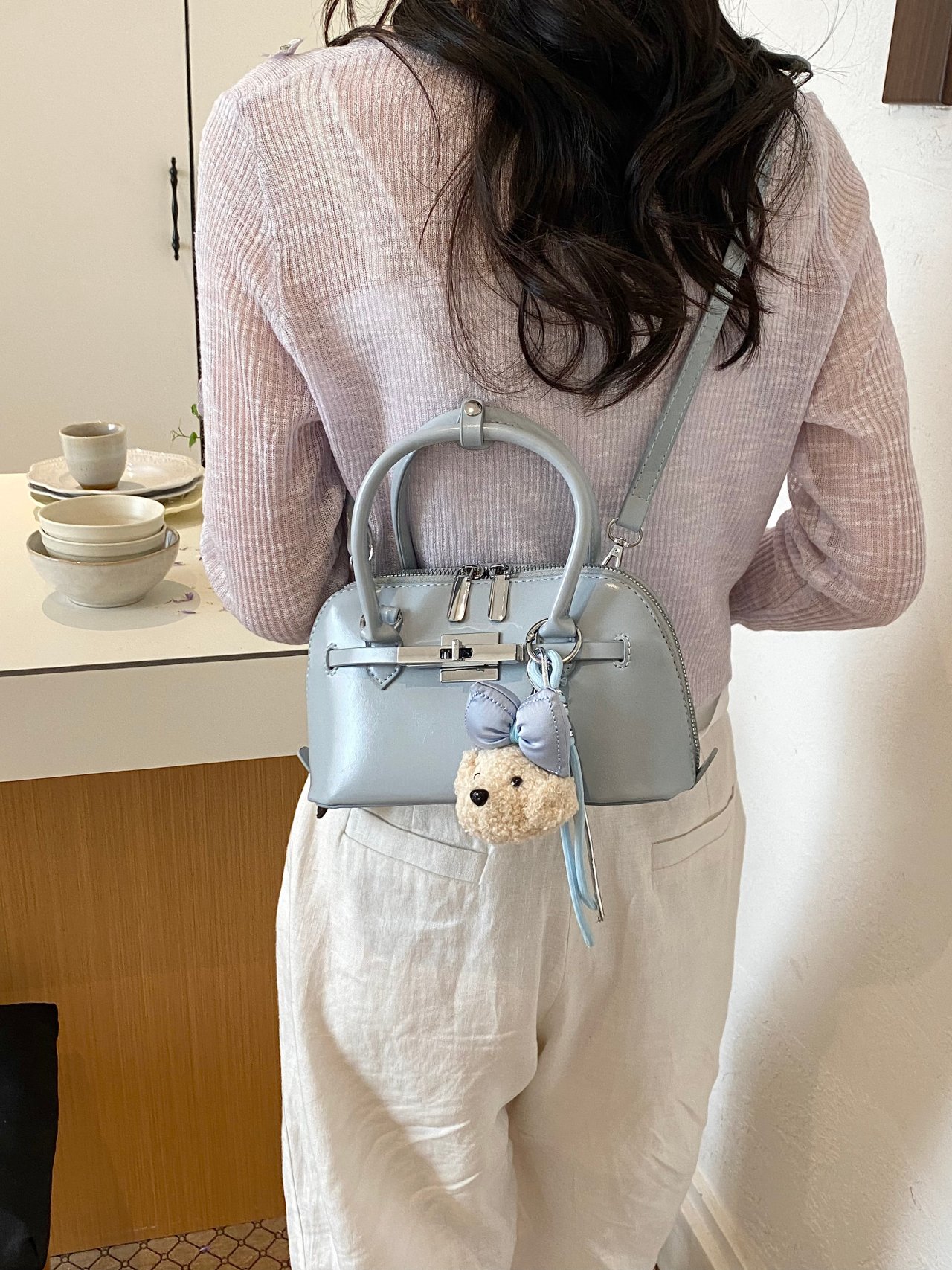 Solid Handbag with Plush Charm and Turn-Lock Detail