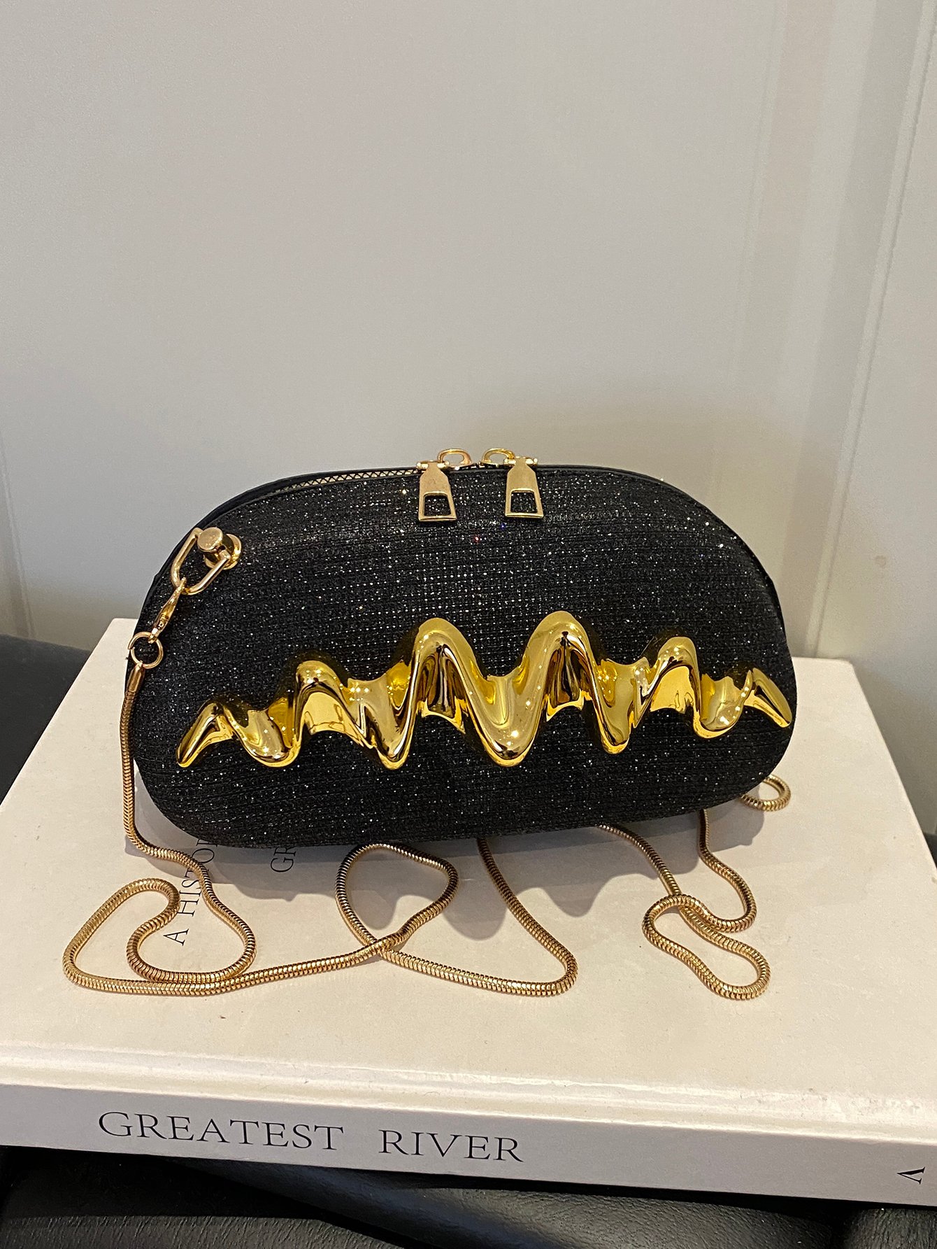 Sparkling Black Sling Bag with Wavy Gold Embellishment