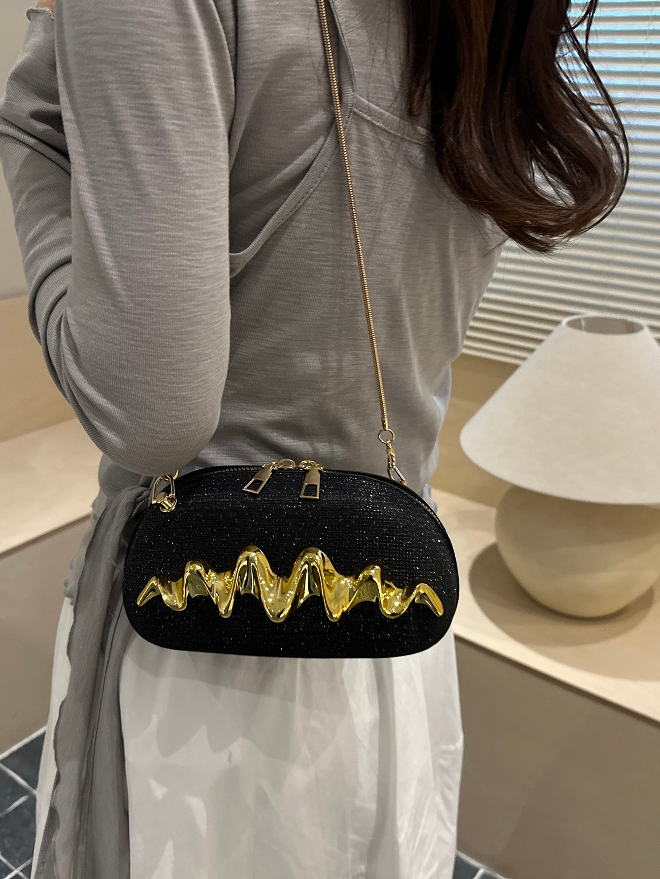 Sparkling Black Sling Bag with Wavy Gold Embellishment