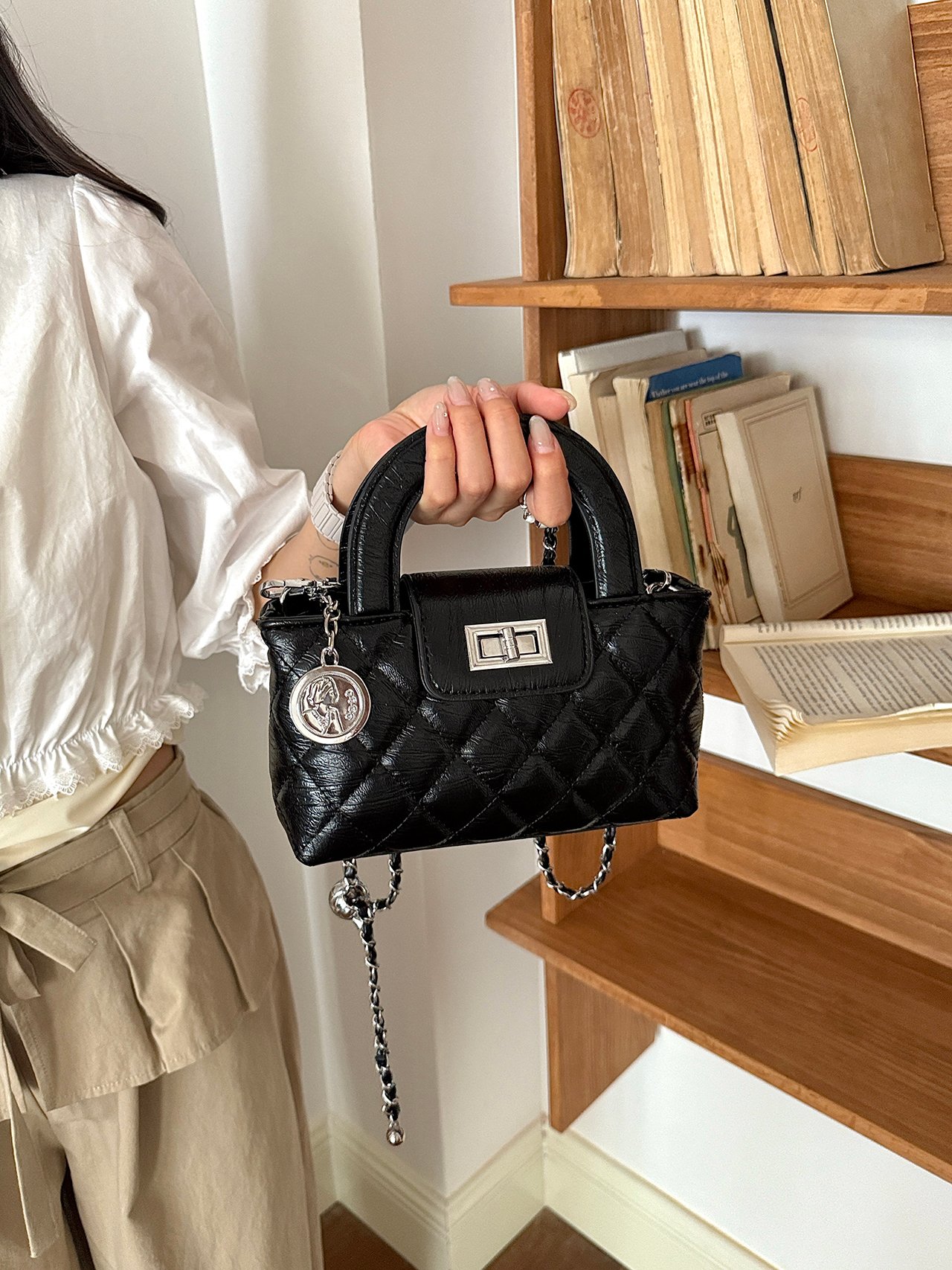 Black Quilted Handbag with Charm