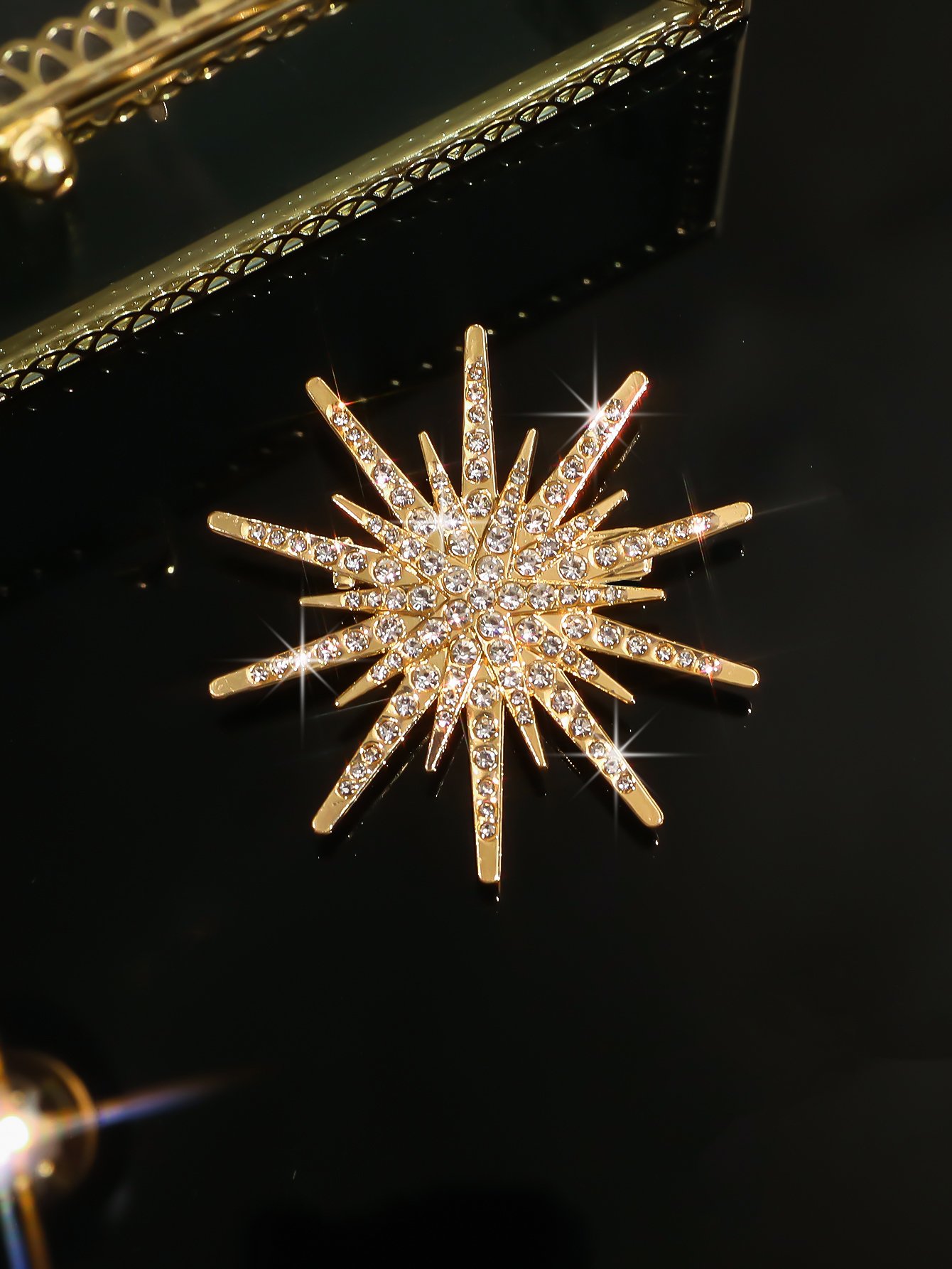 Radiant Gold Starburst Brooch